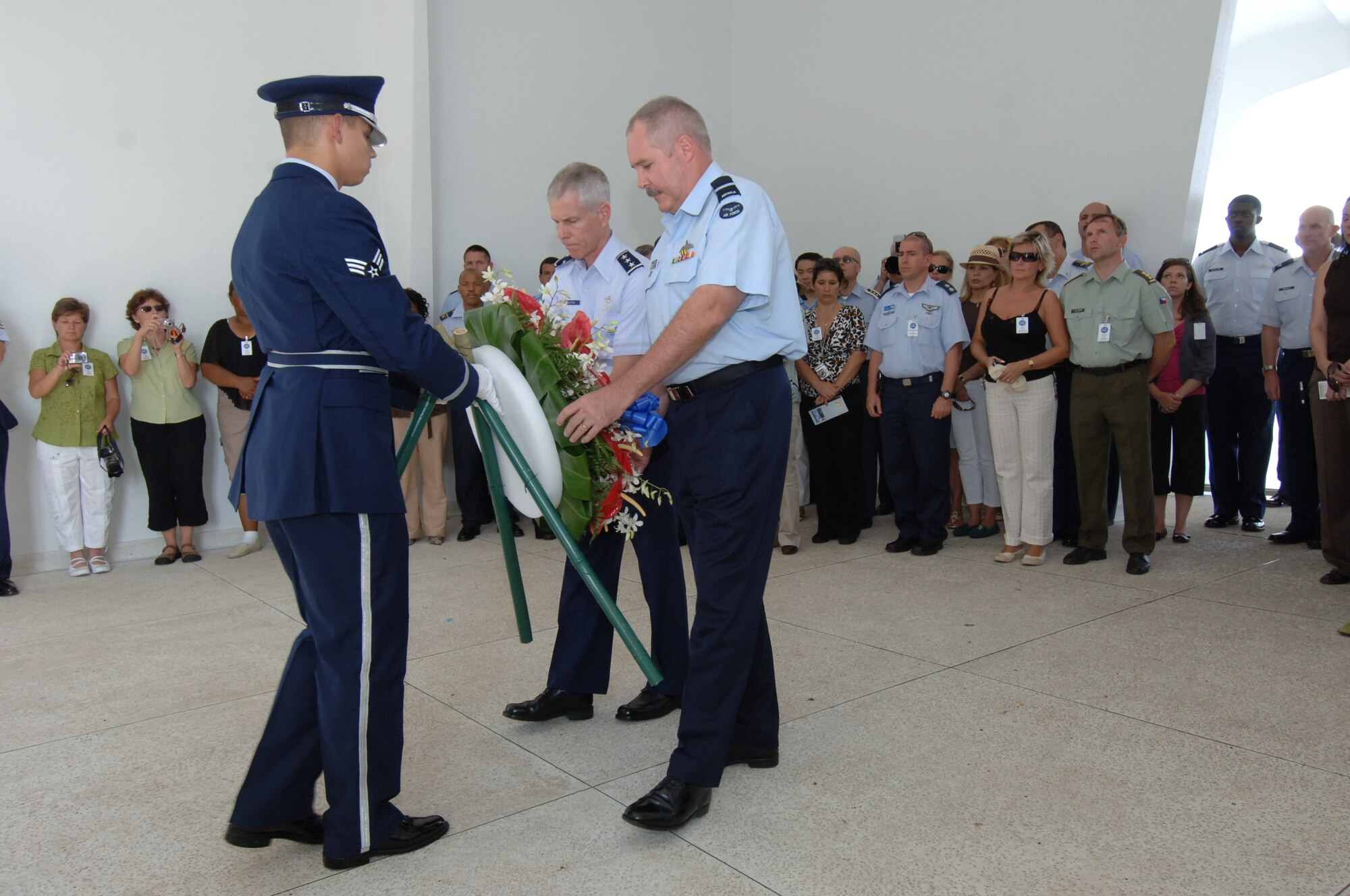 PEARL HARBOR, Hawaii -- Australia Air Attaché Air Commodore Dave Steele and Assistant Vice Chief of Staff Lt. Gen. William Shelton lay a wreath at the U.S.S. Arizona memorial at here in honor of those who lost their lives during the 1941 attacks on the United States. Thirty-seven Air Attachés and their spouses - 78
people total from 32 countries - visited Hawaii during a Chief of Staff-directed annual tour Oct. 4-10. These Attachés, who are representatives of international air forces at the Pentagon in Washington, D.C., get distinguished treatment in the Pacific and Europe during these visits to the theaters of operations for the U.S. Air Force. It is important for the U.S. Air Force to demonstrate its ability to fly, fight and win as well as extend hospitality to allied military forces. While here, the Attachés also visited Pacific Command, Pacific Air Forces, and Joint POW/MIA Accounting Command. (U.S. Air Force photo/Vanessa Forlione)
