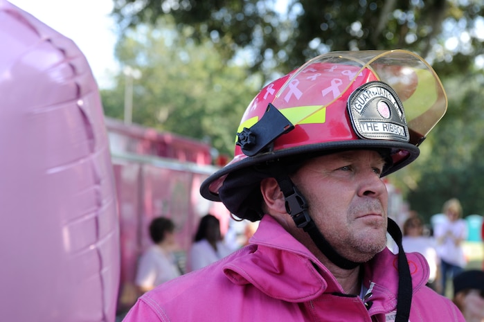 Jeff McCarroll mans up in pink as he participates in the Pink Heals Tour which visited Charleston AFB Oct 9. The Pink Heals Tour features an entourage of volunteer firefighters who tour across the country dressed from head to toe in pink. (U.S. Air Force photo/Senior Airman Amber Grimm)