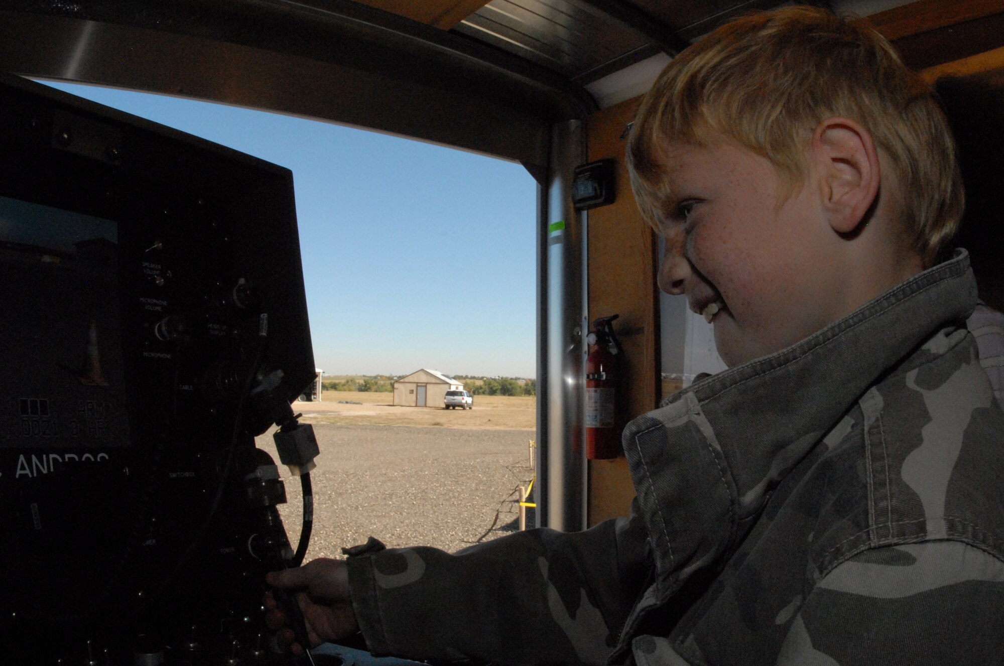 A Buckley youth drives the explosive ordnance disposal robot in one of the several “hands on” events at Buckley’s Youth Mock Deployment Oct 3. (U.S. Air Force photo by Tech. Sgt. J. LaVoie)