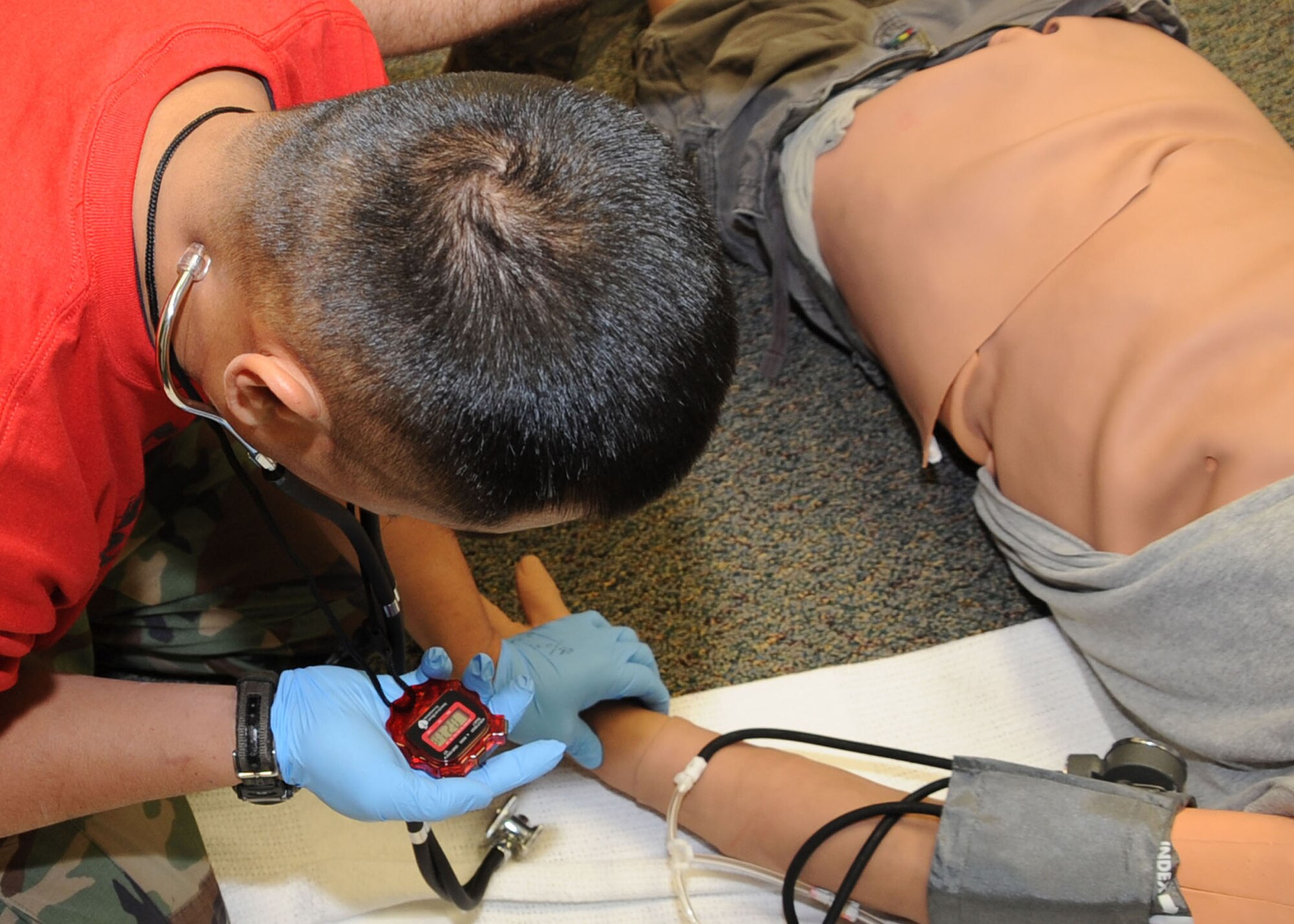 CANNON AIR FORCE BASE, N.M.-- Staff Sgt. Ngu Do, 27th Special Operations Medical Operations Squadron, accesses for the patients pulse during the Emergency Medical Technicians Rodeo Oct. 3. Nine bases from across the Air Force participated this year in the 3rd annual EMT Rodeo. (U.S. Air Force photo by Airman 1st Class Maynelinne Y. De La Cruz)