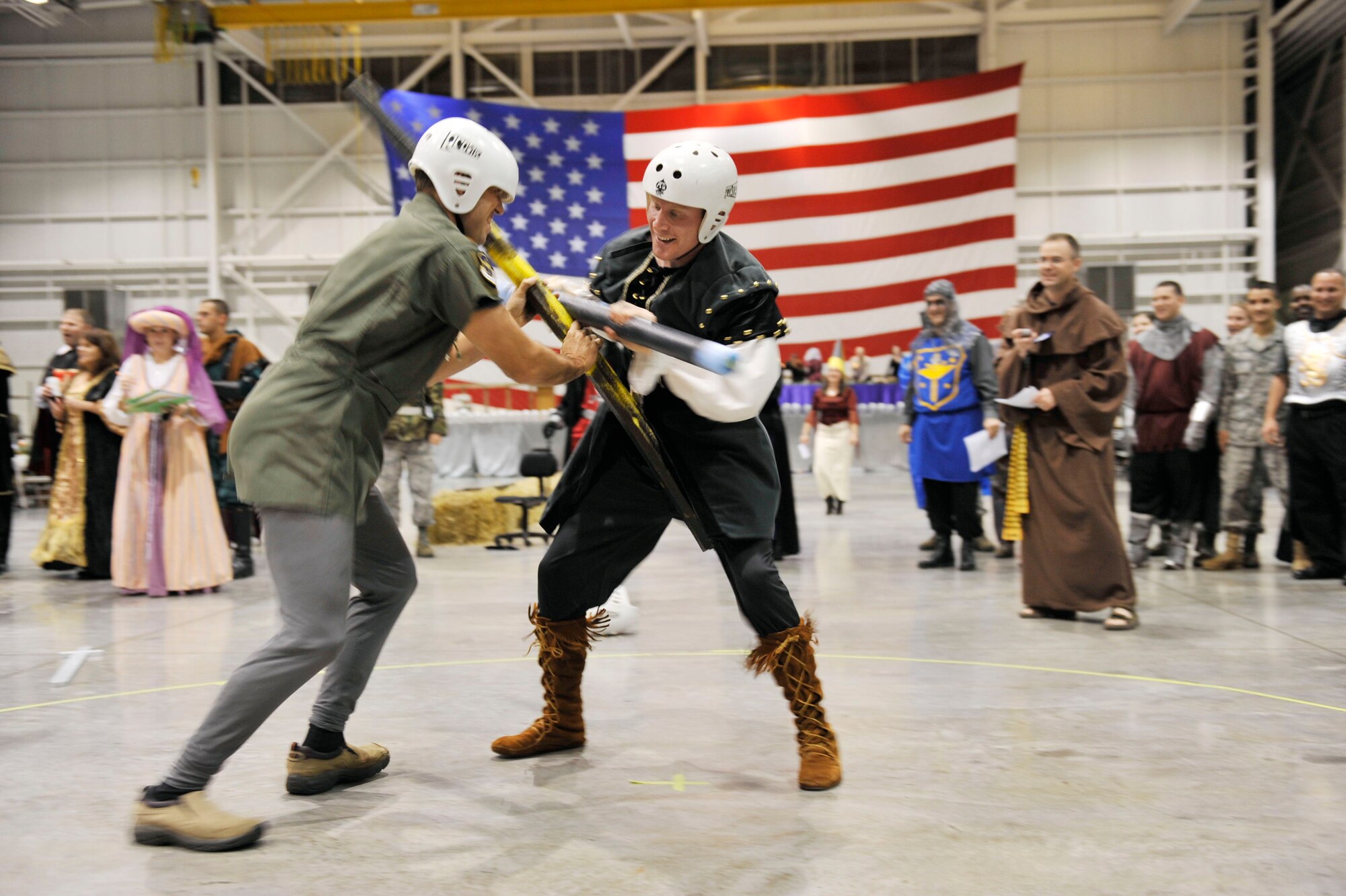 Maj. Chad Taylor, 19th Airlift Wing deputy chief of wing exercises, challenges a Black Knight during a quarterstaff competition at the Black Knight Heritage Dinner on base Oct. 9. The dinner celebrated the 19th Airlift Wing’s rich history as the Air Force’s premier C-130 airlift wing.  (U.S. Air Force photo by Airman Lausanne Pacheco)