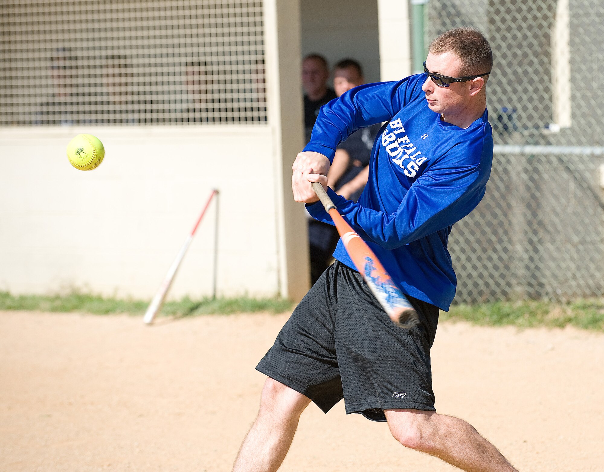 Adam Fike, 436th Security Forces Squadron, swings during the 'Battle of the Badges' Oct. 9. The 436th SFS defeated the fire department 19-7. The 'Battle of the Badges' is a friendly softball game to see whether the police or firefighters will be victorious. (U.S. Air Force photo/Jason Minto)