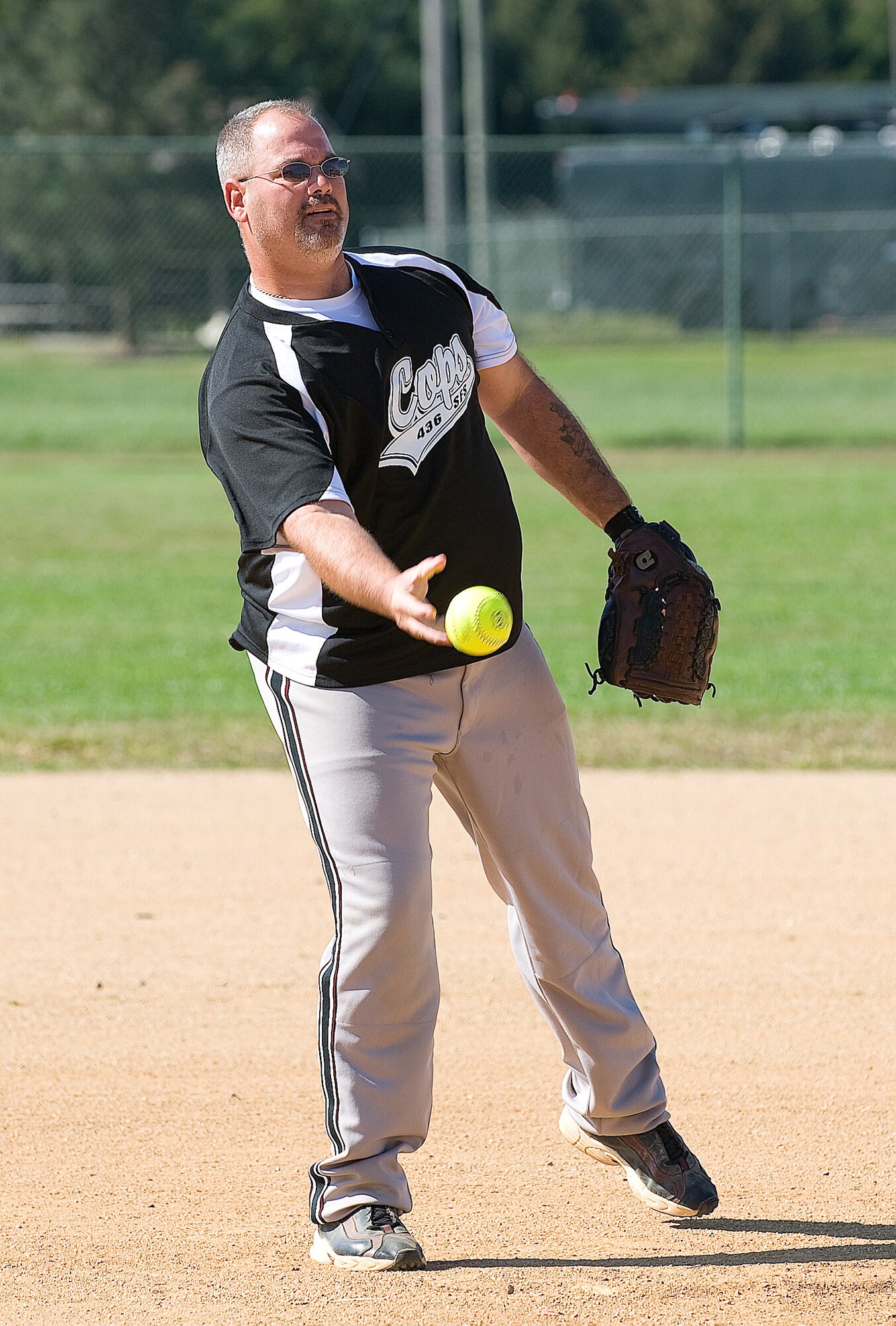 Jon Vanderven, 436th Security Forces Squadron, throws the ball during the 'Battle of the Badges' Oct. 9. The 436th SFS defeated the fire department 19-7. (U.S. Air Force photo/Jason Minto)