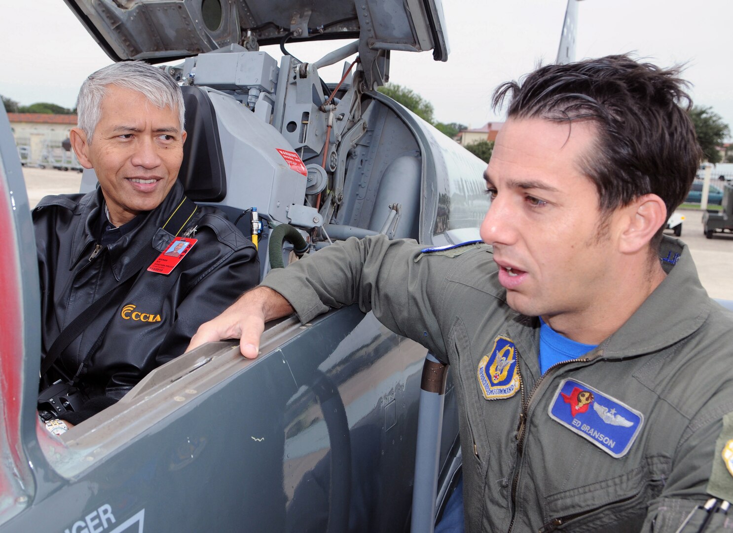 Sichan Siv, a former pilot with the Cambodian Air Force and former U.S. Ambasador to the United Nations, gets a first hand look at the T-38 while Maj. Ed Branson, 39th Flying Ttraining Squadron explaines several of the avionic systems on the T-38.  (U.S. Air Force Photo By Don Lindsey)