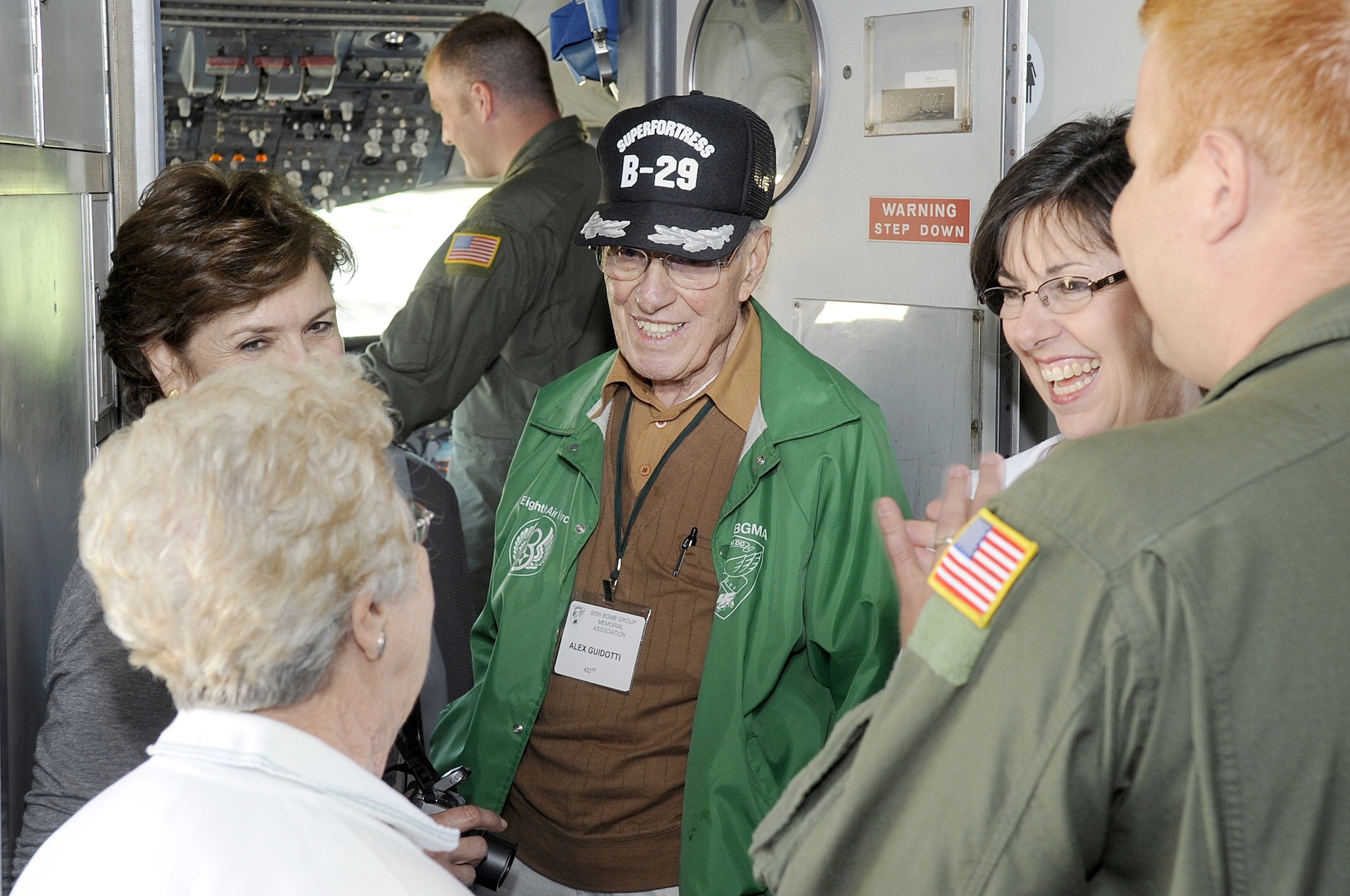 Alex Guidotti, 305th Bomb Group, laughs with family and friends during a guided tour of a KC-10 here Oct. 8.  Members of the 305th Bomb Group Memorial Association also attended a memorial service at the base chapel and a luncheon at the community center as part of their 2009 reunion activities. (U.S. Air Force photo/Carlos Cintron)