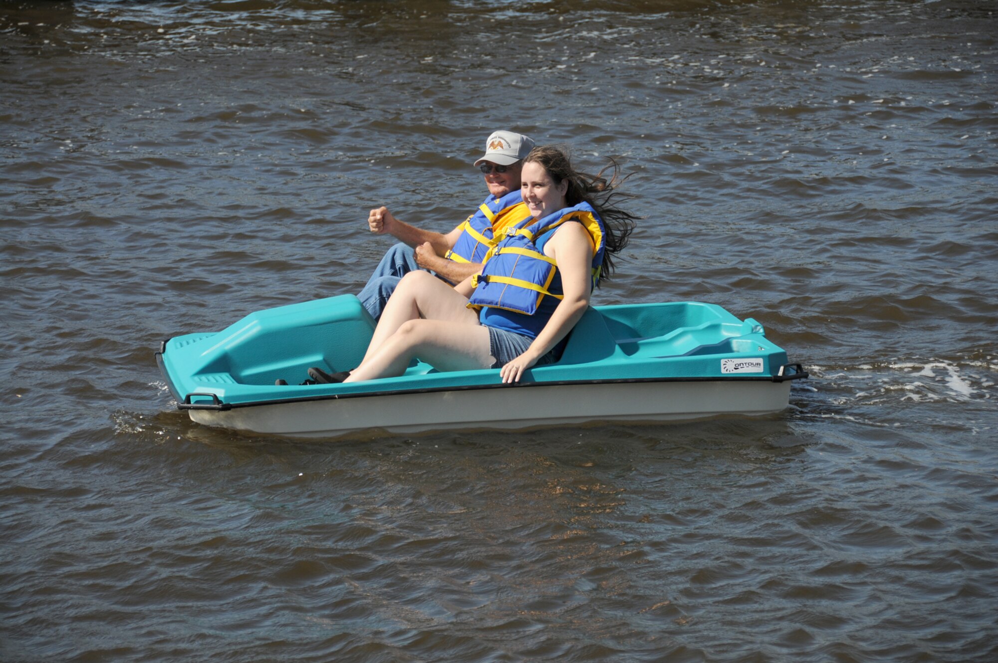 Outdoor recreation employees Doug Stiles and Krisha Cook take one of the new paddle boats out into Biloxi’s Back Bay for a test trip.  Two-person and four-person paddle boats can be rented for $5 an hour for a minimum of two hours.  The first hour is free through November.  For more information, call 377-3160.  (U.S. Air Force photo by Kemberly Groue)