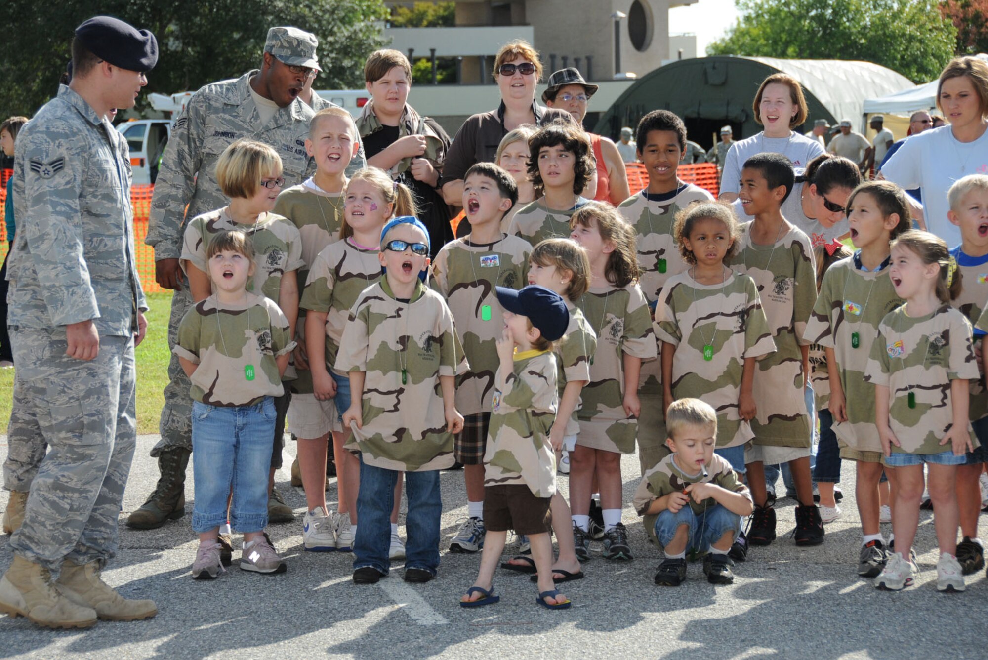 Senior Airman Caleb Foy, 81st Security Forces Squad-ron, leads his team in shouting out their call sign during Saturday’s Operation Hero.  The event, sponsored by the airman and family readiness center, gives children an introduction to what de-ployment is like for their military parents.U.S. Air Force photo by Kemberly Groue)