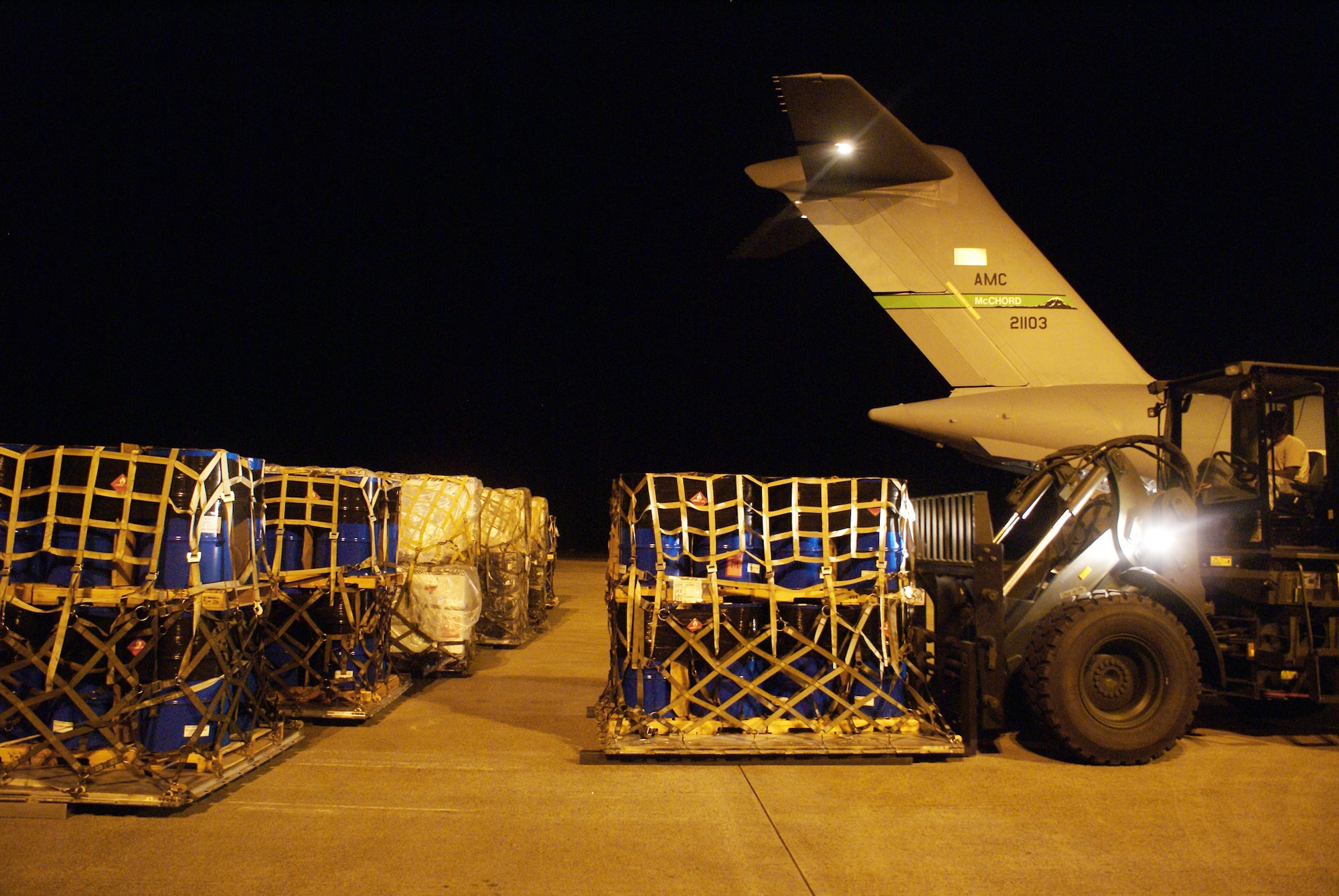 Airmen of the 36th Mobility Response Squadron from Andersen Air Force Base, Guam, use a forklift to off-load cargo from a C-17 Globemaster III on a humanitarian mission Oct. 9, 2009, at Minangkabau International Airport in Padang, Indonesia. (U.S. Air Force photo/Staff Sgt. Eric Burks) 