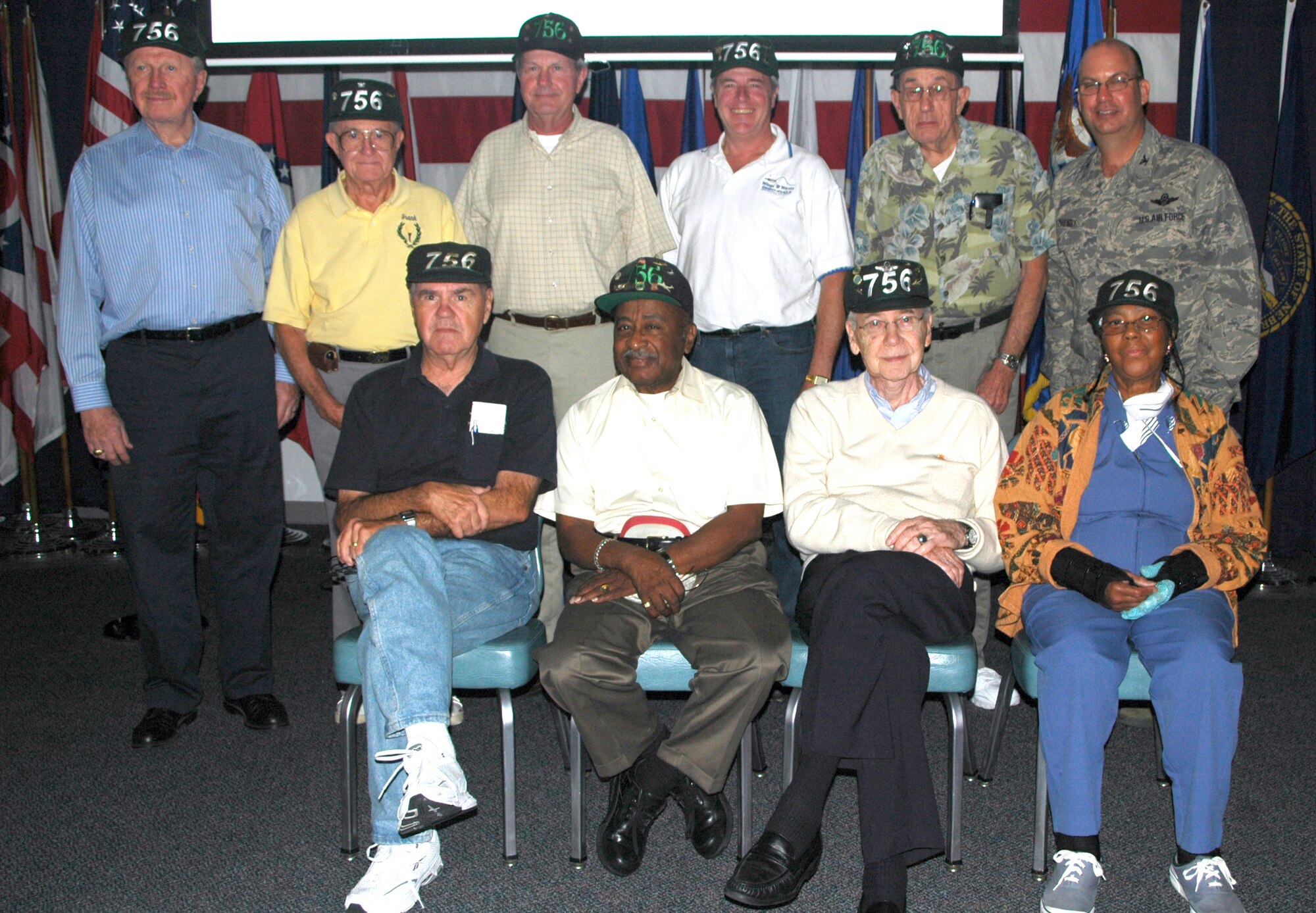 Col. Michael T. Fitzhenry (right), 512th Airlift Wing commander, served as the guest speaker Oct. 9 at the Landings for the 20th reuniion of the 756th Squadron Association. The purpose of the 756th Squadron Association Reunion is to promote and encourage former and current members of units associated with the flying mission of the 459th Air Refueling Wing, Andrews Air Force Base, Md., to remain in touch with one another. Some of the members, pictured with Colonel Fitzhenry, were members of the 756th in the early 1950s. 