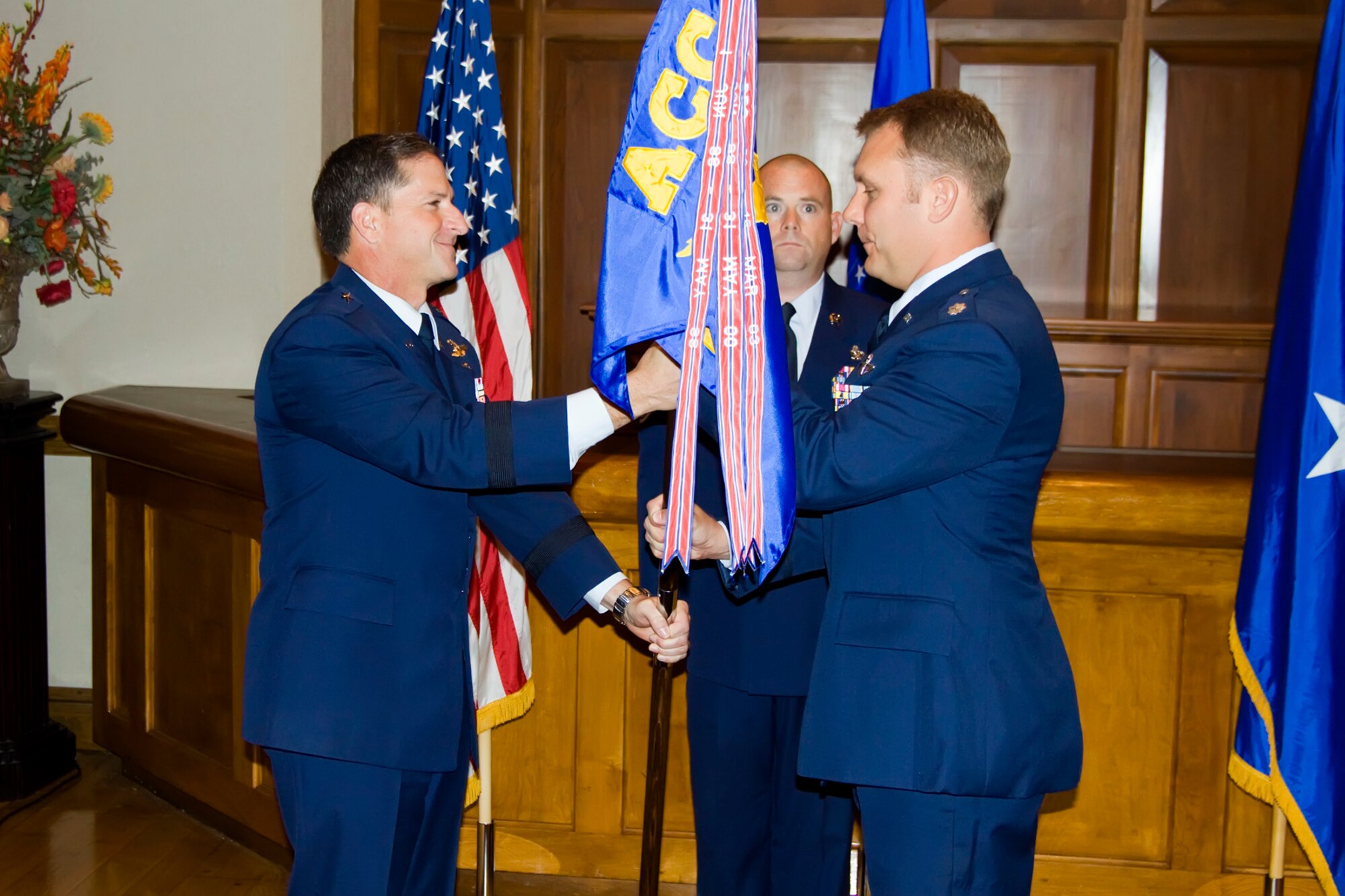 LANGLEY AIR FORCE BASE, Va. -- Brig. Gen. David Goldfein, Air Combat Command Director of Air and Space Operations, passes the guidon to Lt Col. Michael Stetina, as he takes command Oct. 2. (U.S. Air Force photo/Master Sgt. Rod Cannon)
