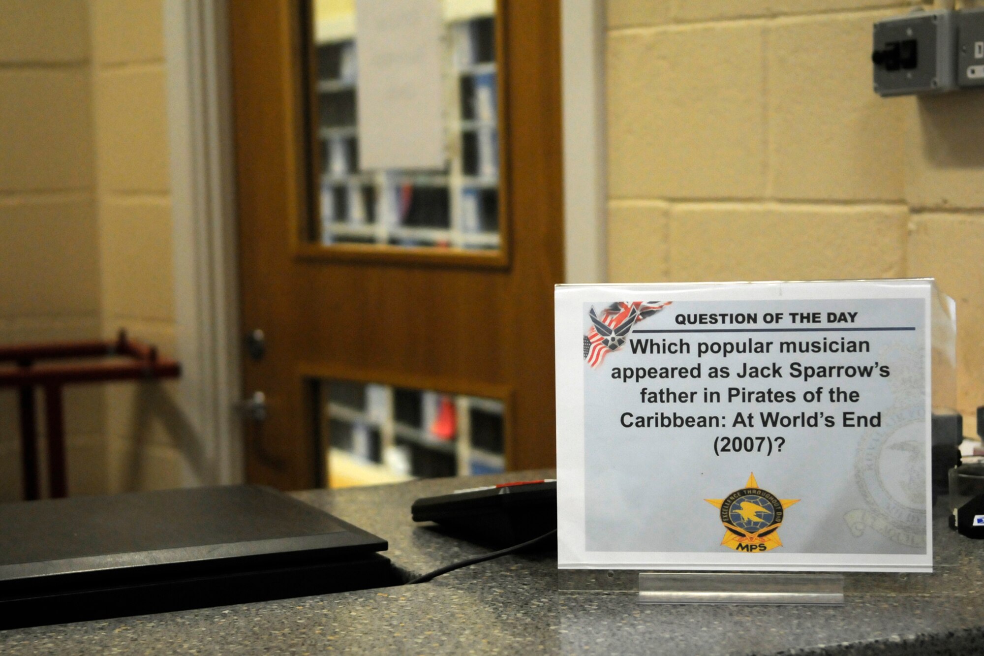 RAF MILDENHALL, England -- Answering the question of the day gets you one of several prizes designed to get children interested in stamp collecting during national stamp month at the base post office Oct. 14.  (U.S. Air Force photo/Staff Sgt. Christopher L. Ingersoll)