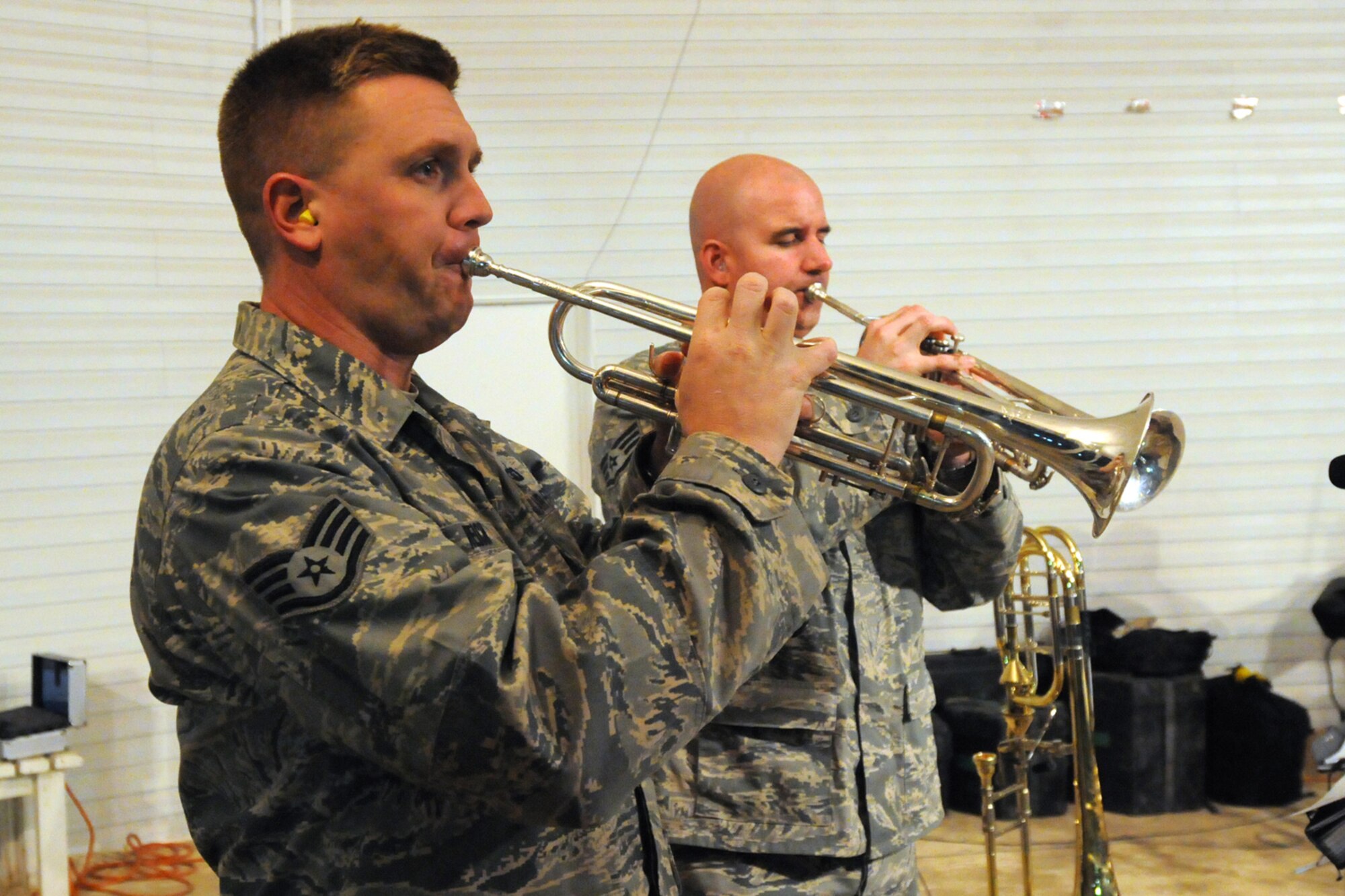 KIRKUK REGIONAL AIR BASE, Iraq - Staff Sgt's. Jeff Reich and Eric Proper, AFCENT Band Falcon, trumpet players, perform at the Wagon Wheel stage here Oct. 7.  Falcon performed for Airmen, Soldiers and civilian contractors at various locations on base including the dining facility, the Wagon Wheel stage and the Clamtina community center from Oct. 7-9. Sergeant's Reich and Proper are deployed in Southwest Asia from the U.S. Air Force Heartland of American Band, Offutt Air Force Base, Neb.  (U.S. Air Force photo/Staff Sgt. Joshua Breckon)