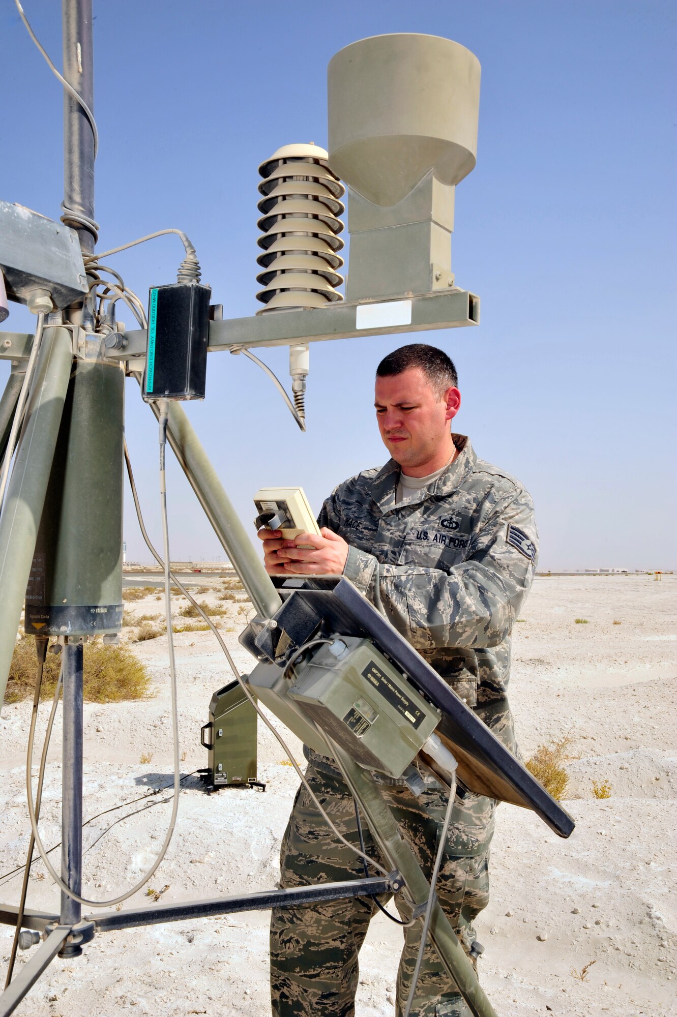 SOUTHWEST ASIA -Staff Sgt. Joshua Mace, 380th Expeditionary Operations Support Squadron weather forecaster, checks the status of the battery on a tactical meteorological observation system Oct. 13, 2009. Sergeant Mace is deployed from Beale Air Force Base, Calif., and hails from Eugene, Ore. (U.S. Air Force photo/Tech. Sgt. Charles Larkin Sr)