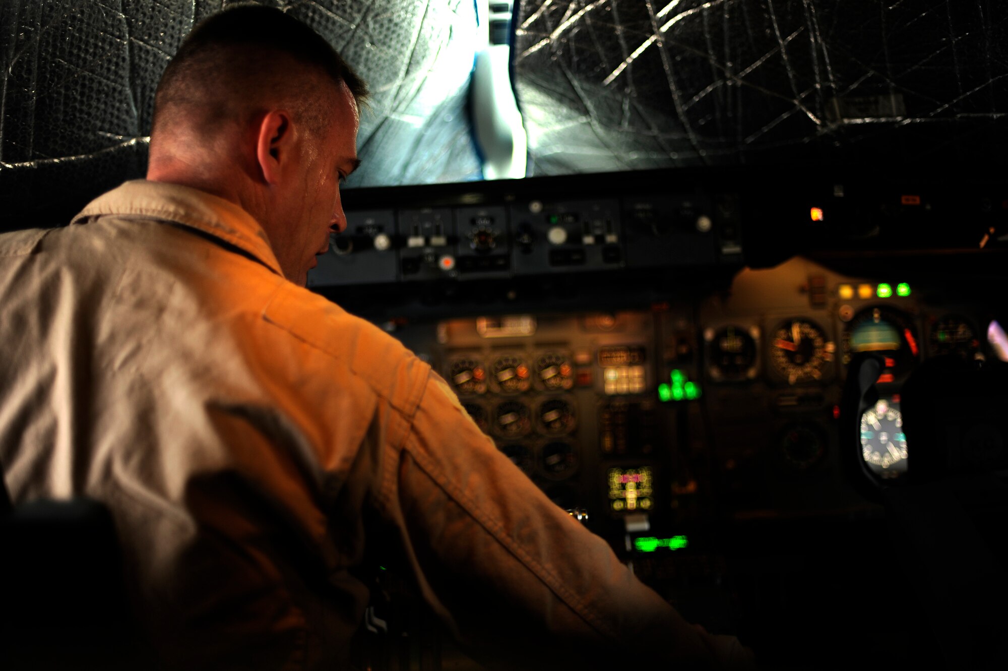 SOUTHWEST ASIA - U.S. Air Force Tech. Sgt. Bud Jensen, a flight engineer from the 908th Air Refueling Squadron, conducts pre-flight checks onboard a KC-10A Extender prior to a refueling mission over Afghanistan, Oct. 2, 2009. (U.S. Air Force photo/Staff Sgt. Michael B. Keller)
