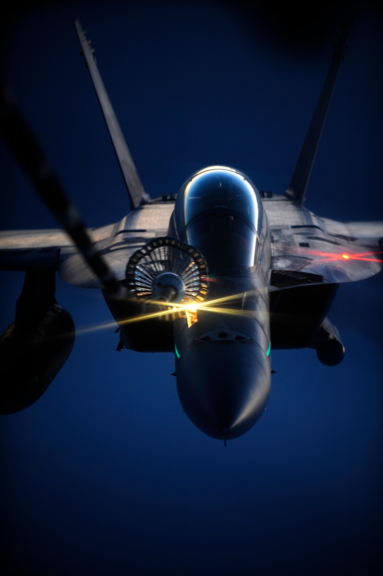 AFGHANISTAN - A U.S. Navy F-18 Hornet receives fuel from a 908th Expeditionary Air Refueling Squadron KC-10A Extender over Afghanistan, Oct. 5, 2009.  (U.S. Air Force photo/Staff Sgt. Michael B. Keller)