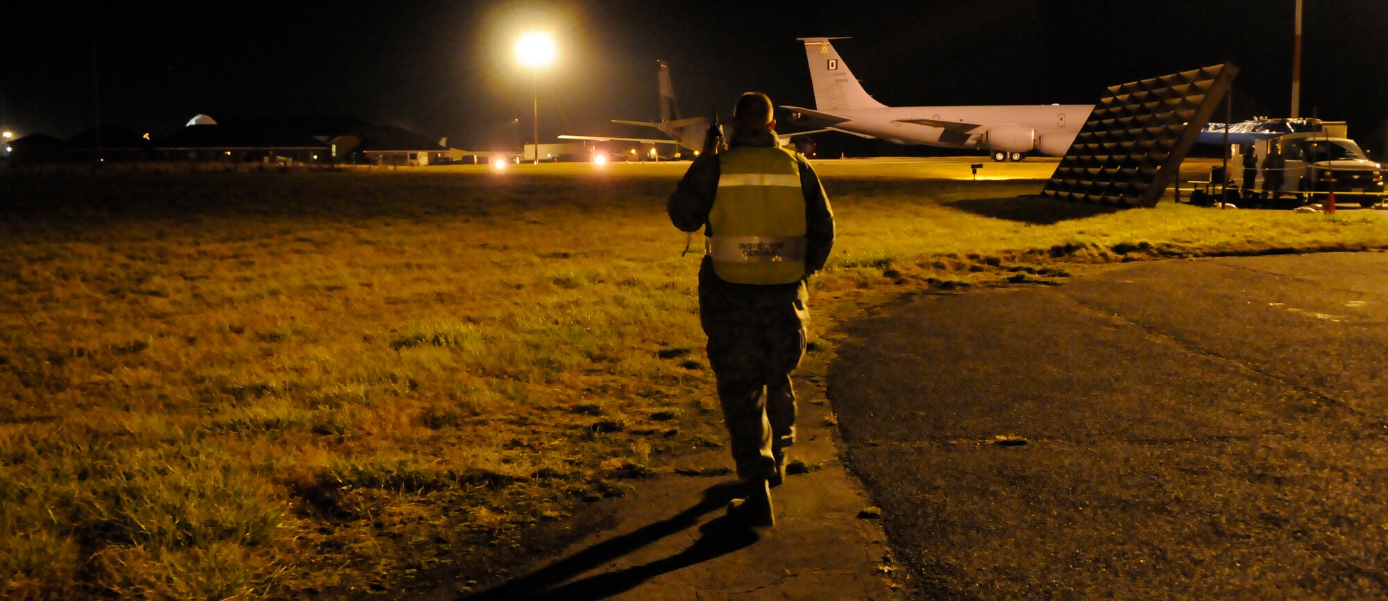 RAF MILDENHALL, England -- Capt. David Marce, Inspector General team member, shouts "exercise, exercise, exercise, we have your compatriot!" over the radio as part of a scenario during the Operational Readiness Inspection Oct. 13.  The scenario tests a units’ abilities to continue operations when they have lost a person.  (U.S. Air Force photo/Staff Sgt. Christopher L. Ingersoll)