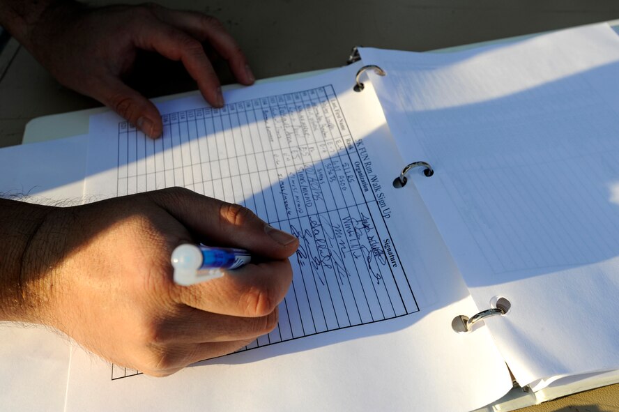 An Airman signs up for the Combined Federal Campaign 5-K run at Osan Air Base, Republic of Korea, Oct. 10.  The CFC began Oct. 5 and runs through Dec. 4. The mission of the CFC is to promote and support philanthropy through a program that is employee focused, cost-efficient and effective in providing all federal employees the opportunity to improve the quality of life for all. (U.S. Air Force photo/Senior Airman Stephenie Wade)

