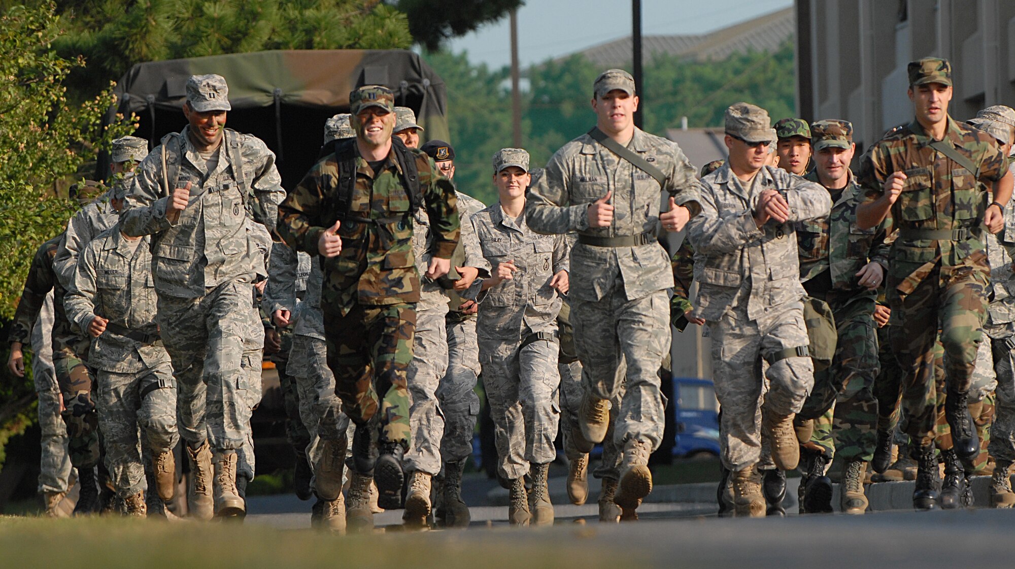 KUNSAN AIR BASE, Republic of Korea -- Wolf Pack members begin a 2.6 mile run during the 8th Security Forces Squadron Combat Challenge held at Kunsan Air Base Oct. 9. There were 14 teams of four individuals competing in the challenge but the team consisting of Staff Sgt. Jeremy Gamache, Tech. Sgt. Eric Adams, Airman 1st Class Michael Willman and Staff Sgt. Jonathan Geren, from the 8th SFS won the event. (U.S. Air Force photo/Senior Airman Roy Lynch)