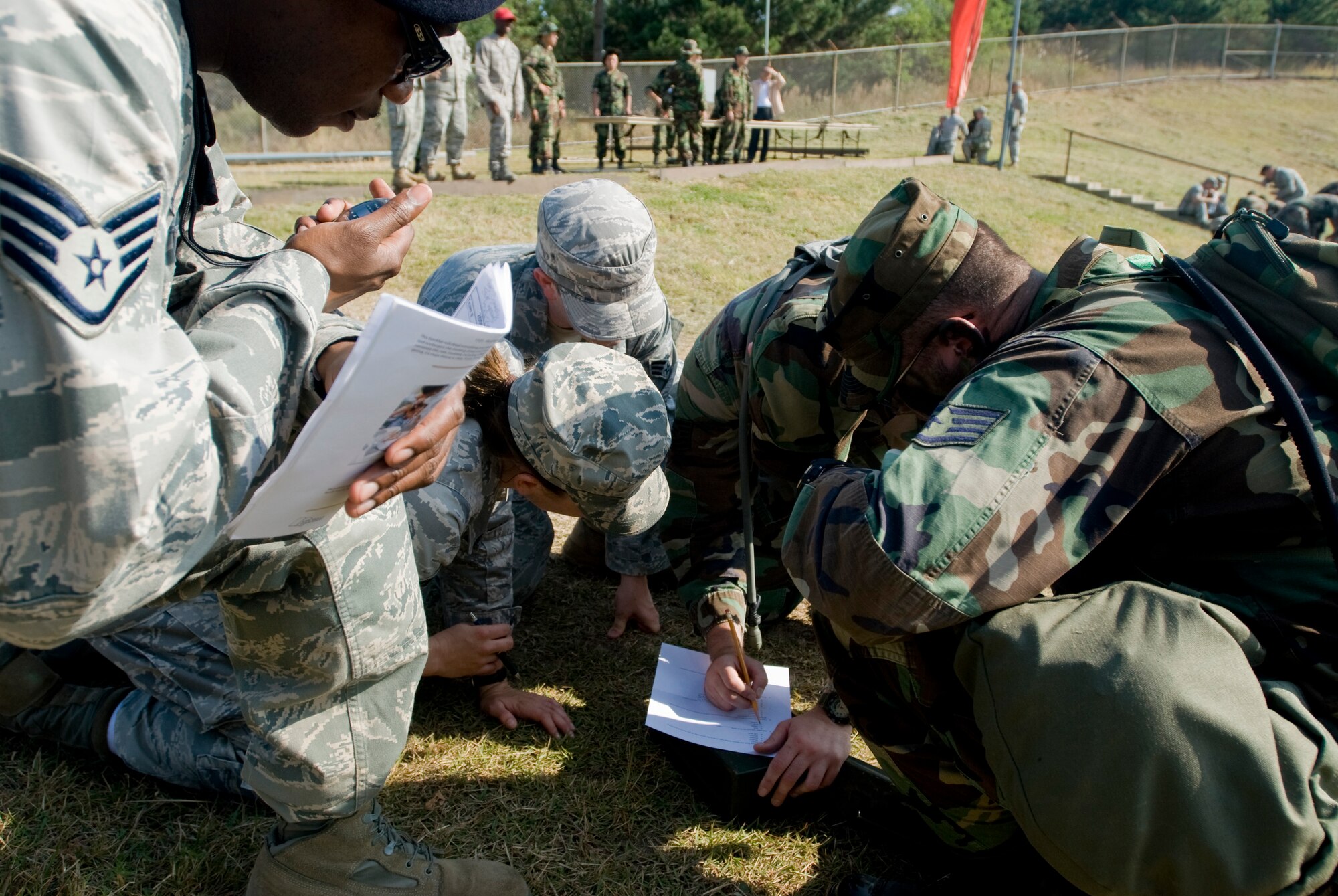 KUNSAN AIR BASE, Republic of Korea -- Members from the 8th Security Forces Squadron take an Air Force knowledge test during the 8 SFS Combat Challenge Oct. 9.The Combat Challenge consisted of a four-member team working together to compete various  activities. (U.S. Air Force photo/Senior Airman Jonathan Steffen)