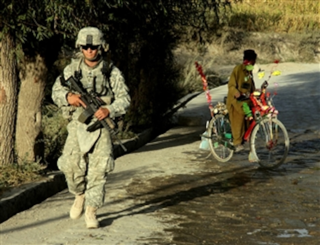 U.S. Army Sgt. Kyle Brown patrols through a village with his platoon near Combat Outpost Herrera, in Paktiya province, Afghanistan, on Oct. 11, 2009.  The soldiers were searching for sites the Taliban has been using to fire rockets at the outpost.  Brown is deployed with Apache Troop, 1st Squadron, 40th Cavalry Regiment.  