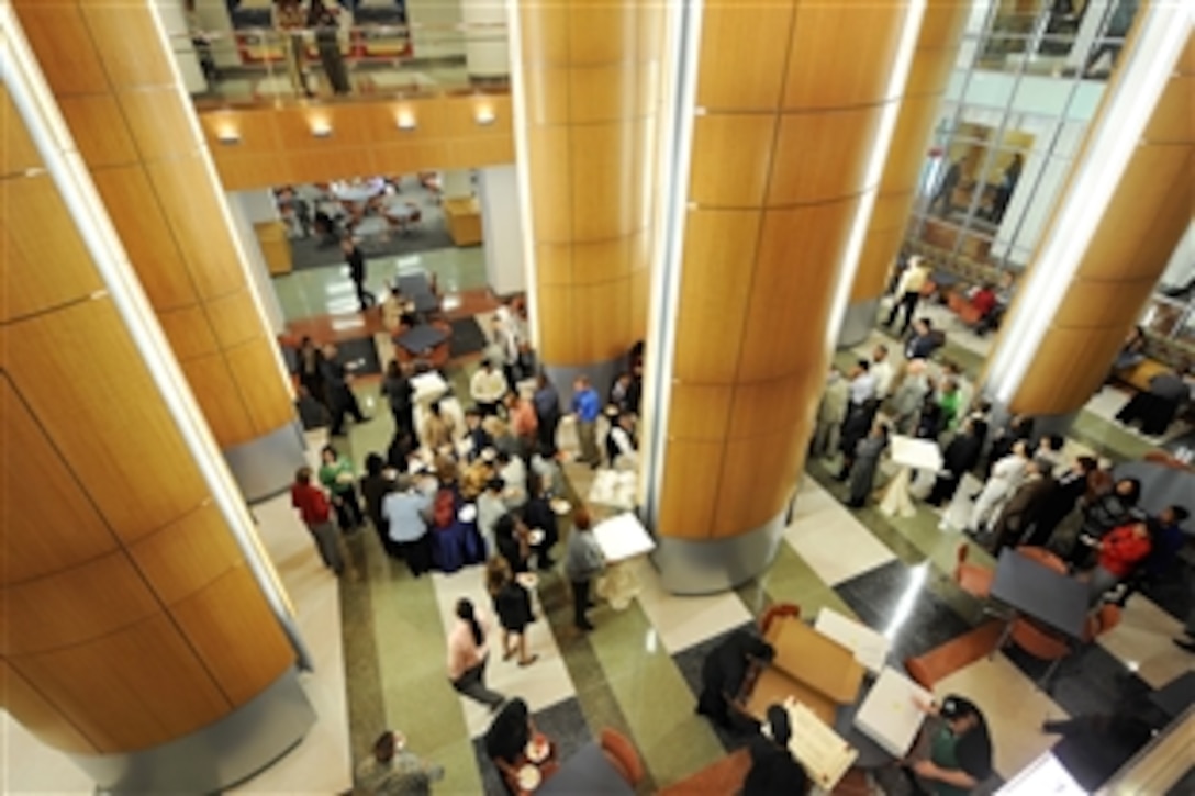 Pentagon employees enjoy free refreshments during opening ceremonies for the new concourse at the Pentagon, Oct. 14, 2009.  The area features shops, services and food establishments for workers in the world's largest office building.  