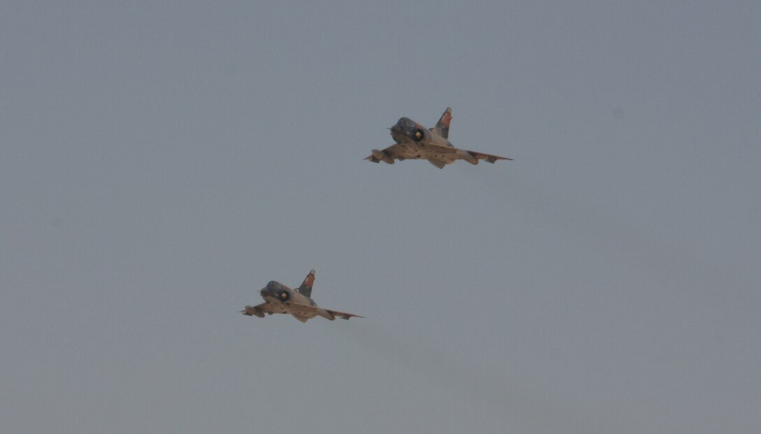 Two Egyptian Air Force Mirage fighter jets execute a bombing run during a Combined-Arms Live-Fire Exercise conducted as part of Exercise Bright Star 2009 in Egypt, Oct. 14, 2009. The multinational exercise is designed to improve readiness, interoperability, and strengthen the military and professional relationships among U.S., Egyptian and participating forces. Bright Star is conducted by U.S. Central Command and held every two years. Elements of the 22nd MEU are currently are participating in the multi-national exercise while serving as the theater reserve force for U.S. Central Command.::r::::n::(Official Marine Corps photo by Staff Sgt. Matt Epright)::r::::n::