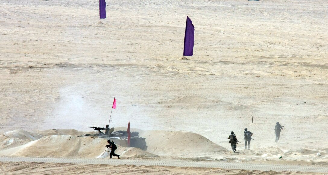 Egyptian soldiers dismount their armored personnel carrier during a Combined-Arms Live-Fire Exercise conducted as part of Exercise Bright Star 2009 in Egypt, Oct. 14, 2009. The multinational exercise is designed to improve readiness, interoperability, and strengthen the military and professional relationships among U.S., Egyptian and participating forces. Bright Star is conducted by U.S. Central Command and held every two years. Elements of the 22nd MEU are currently are participating in the multi-national exercise while serving as the theater reserve force for U.S. Central Command.::r::::n::(Official Marine Corps photo by Staff Sgt. Matt Epright)::r::::n::