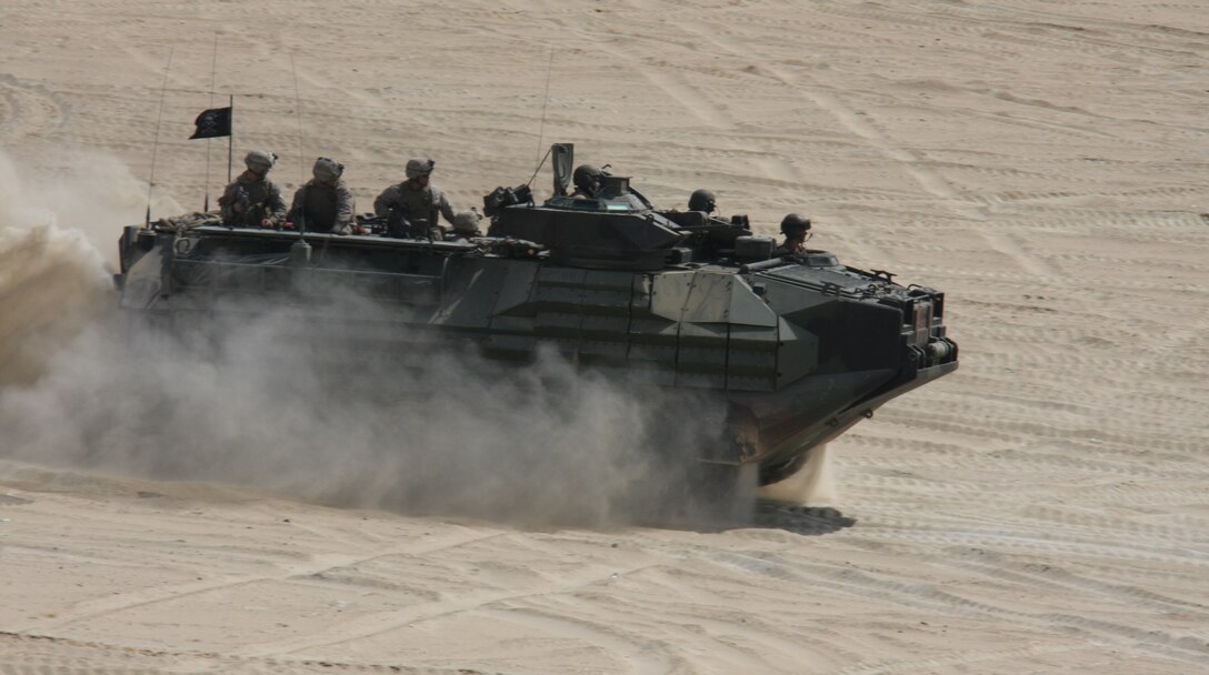 An Amphibious Assault Vehicle attached to India Company, Battalion Landing Team, 3rd Battalion, 2nd Marine Regiment, 22nd Marine Expeditionary Unit, approaches a firing position during a Combined-Arms Live-Fire Exercise conducted as part of Exercise Bright Star 2009 in Egypt, Oct. 14, 2009. The multinational exercise is designed to improve readiness, interoperability, and strengthen the military and professional relationships among U.S., Egyptian and participating forces. Bright Star is conducted by U.S. Central Command and held every two years. Elements of the 22nd MEU are currently are participating in the multi-national exercise while serving as the theater reserve force for U.S. Central Command.::r::::n::(Official Marine Corps photo by Staff Sgt. Matt Epright)::r::::n::