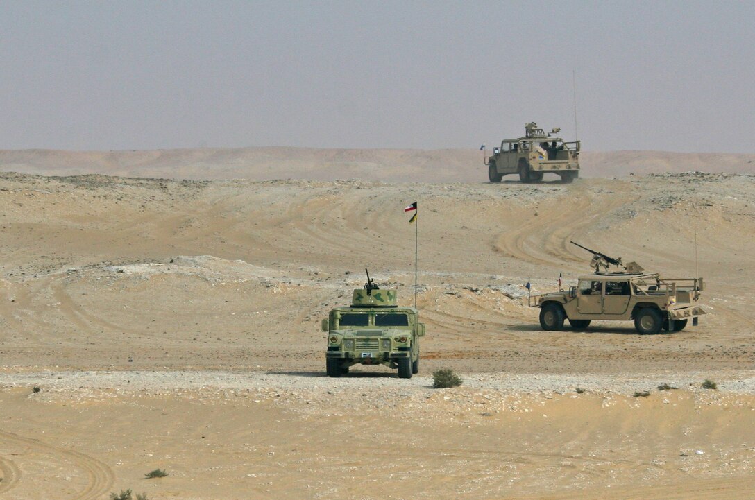 Three Kuwaiti Humvees prepare for a Combined-Arms Live-Fire Exercise conducted as part of Exercise Bright Star 2009 in Egypt, Oct. 14, 2009. The multinational exercise is designed to improve readiness, interoperability, and strengthen the military and professional relationships among U.S., Egyptian and participating forces. Bright Star is conducted by U.S. Central Command and held every two years. Elements of the 22nd MEU are currently are participating in the multi-national exercise while serving as the theater reserve force for U.S. Central Command.::r::::n::(Official Marine Corps Photo by Cpl. Theodore W. Ritchie)::r::::n::