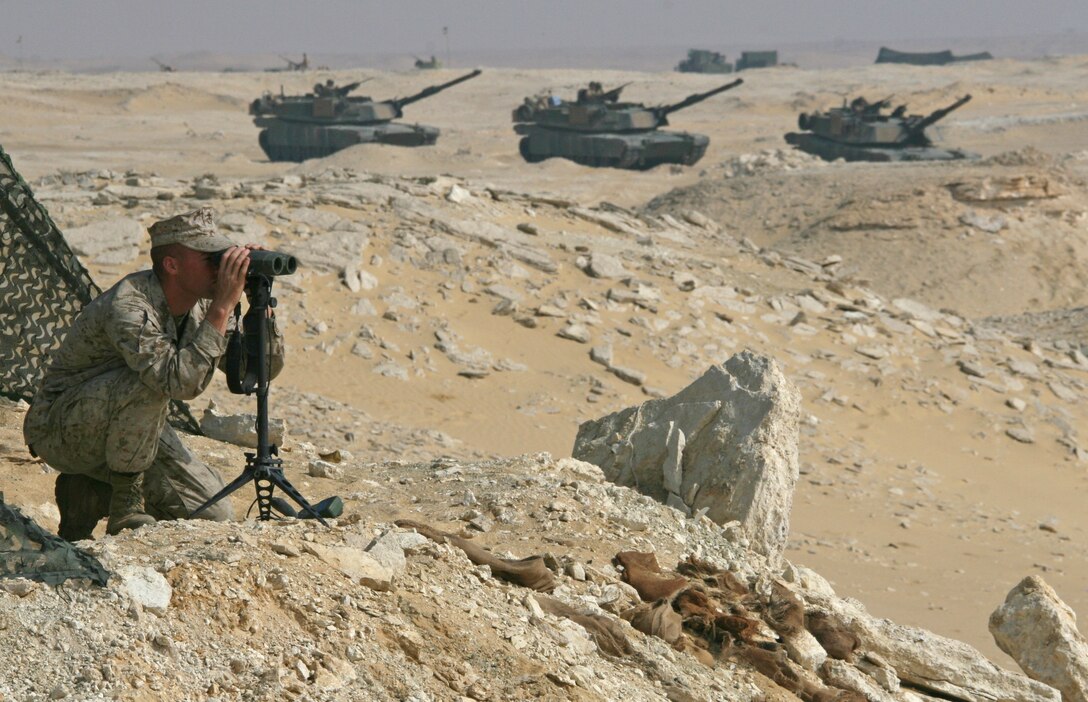 Sgt. Buddy I. Dagostino, a forward observer with India Company, Battalion Landing Team, 3rd Battalion, 2nd Marine Regiment, 22nd Marine Expeditionary Unit, and native of Plymouth, Mass., surveys range targets during a Combined-Arms Live-Fire Exercise conducted as part of Exercise Bright Star 2009 in Egypt, Oct. 14, 2009. The multinational exercise is designed to improve readiness, interoperability, and strengthen the military and professional relationships among U.S., Egyptian and participating forces. Bright Star is conducted by U.S. Central Command and held every two years. Elements of the 22nd MEU are currently are participating in the multi-national exercise while serving as the theater reserve force for U.S. Central Command.::r::::n::(Official Marine Corps Photo by Cpl. Theodore W. Ritchie)::r::::n::