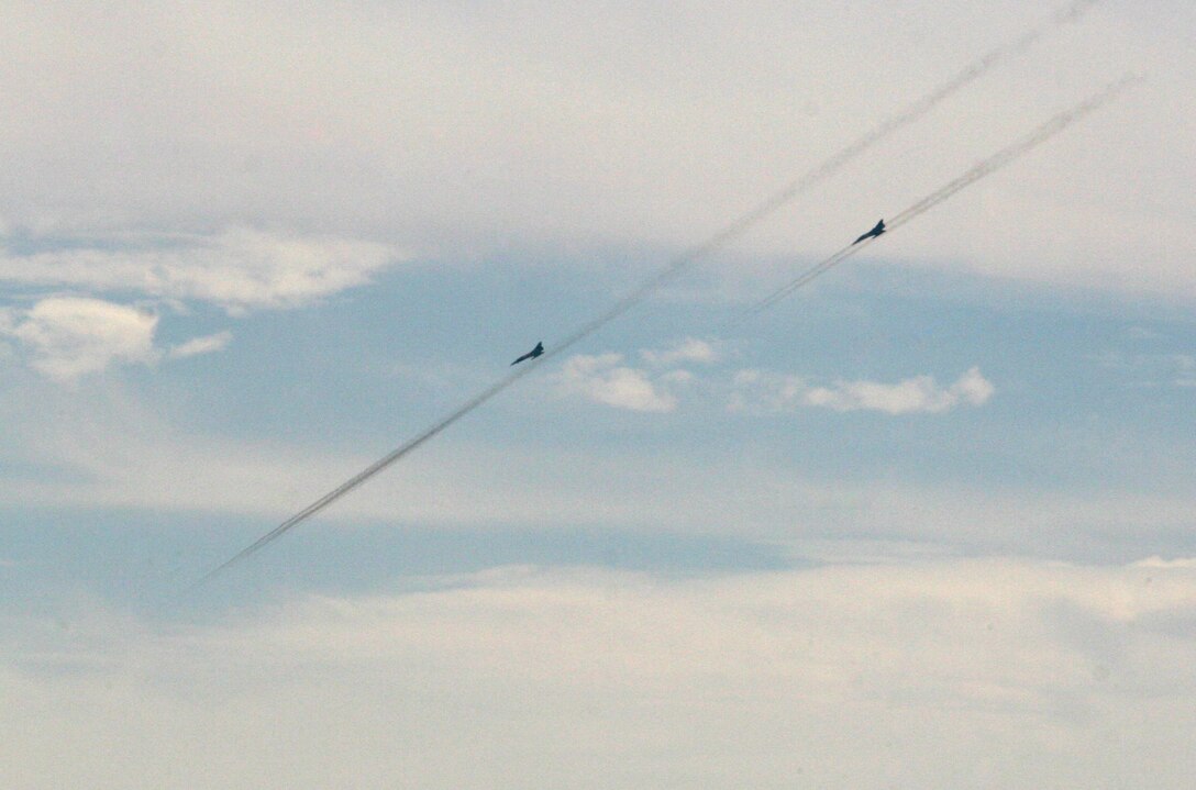 Two Egyptian Air Force Mirage fighter jets fire missiles during a Combined-Arms Live-Fire Exercise conducted as part of Exercise Bright Star 2009 in Egypt, Oct. 14, 2009. The multinational exercise is designed to improve readiness, interoperability, and strengthen the military and professional relationships among U.S., Egyptian and participating forces. Bright Star is conducted by U.S. Central Command and held every two years. Elements of the 22nd MEU are currently are participating in the multi-national exercise while serving as the theater reserve force for U.S. Central Command.::r::::n::(Official Marine Corps Photo by Cpl. Theodore W. Ritchie)::r::::n::