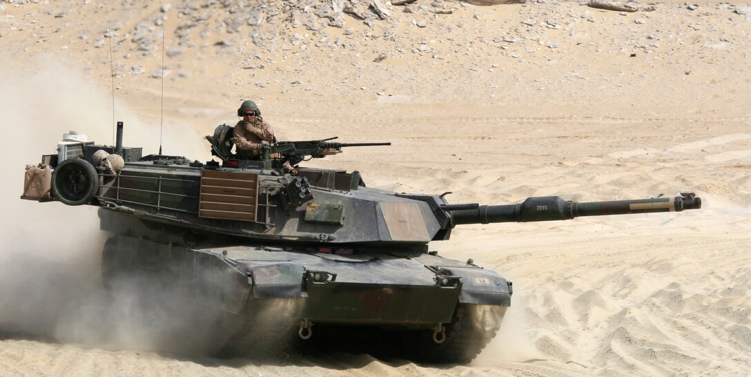 An M1-A1 Abrams Main Battle Tank, attached to India Company, Battalion Landing Team, 3rd Battalion, 2nd Marine Regiment, 22nd Marine Expeditionary Unit, rumbles across a live-fire range during a Combined-Arms Live-Fire Exercise conducted as part of Exercise Bright Star 2009 in Egypt, Oct. 14, 2009. The multinational exercise is designed to improve readiness, interoperability, and strengthen the military and professional relationships among U.S., Egyptian and participating forces. Bright Star is conducted by U.S. Central Command and held every two years. Elements of the 22nd MEU are currently are participating in the multi-national exercise while serving as the theater reserve force for U.S. Central Command.::r::::n::(Official Marine Corps Photo by Cpl. Theodore W. Ritchie)::r::::n::