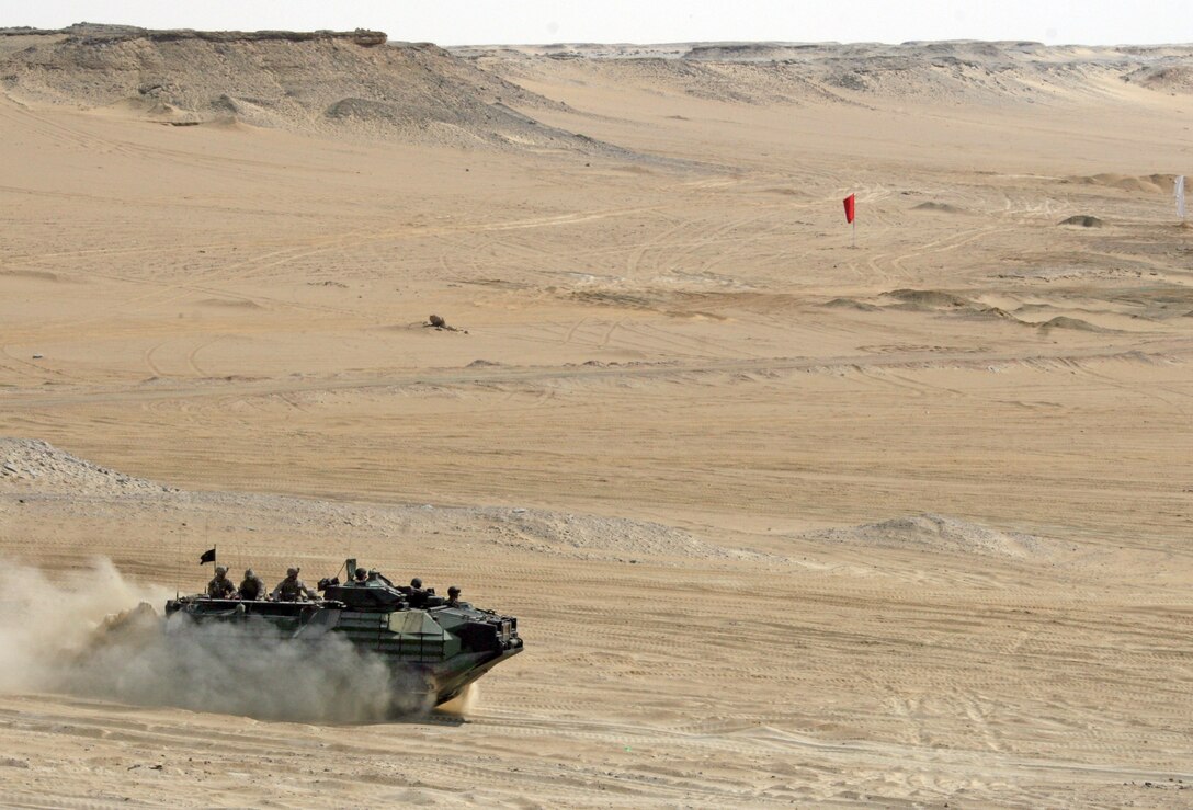 An Amphibious Assault Vehicle attached to India Company, Battalion Landing Team, 3rd Battalion, 2nd Marine Regiment, 22nd Marine Expeditionary Unit, approaches a firing position during a Combined-Arms Live-Fire Exercise conducted as part of Exercise Bright Star 2009 in Egypt, Oct. 14, 2009. The multinational exercise is designed to improve readiness, interoperability, and strengthen the military and professional relationships among U.S., Egyptian and participating forces. Bright Star is conducted by U.S. Central Command and held every two years. Elements of the 22nd MEU are currently are participating in the multi-national exercise while serving as the theater reserve force for U.S. Central Command.::r::::n::(Official Marine Corps Photo by Cpl. Theodore W. Ritchie)::r::::n::