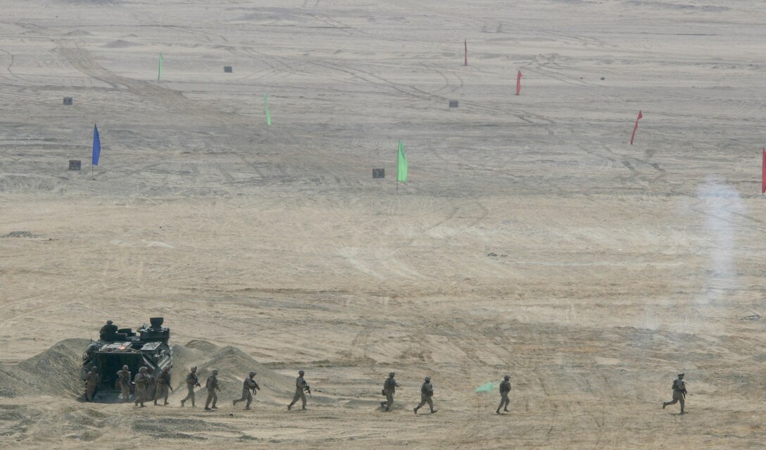Marines from India Company, Battalion Landing Team, 3rd Battalion, 2nd Marine Regiment, 22nd Marine Expeditionary Unit, dismount an Amphibious Assault Vehicle during a Combined-Arms Live-Fire Exercise conducted as part of Exercise Bright Star 2009 in Egypt, Oct. 14, 2009. The multinational exercise is designed to improve readiness, interoperability, and strengthen the military and professional relationships among U.S., Egyptian and participating forces. Bright Star is conducted by U.S. Central Command and held every two years. Elements of the 22nd MEU are currently are participating in the multi-national exercise while serving as the theater reserve force for U.S. Central Command.::r::::n::(Official Marine Corps Photo by Cpl. Theodore W. Ritchie)::r::::n::