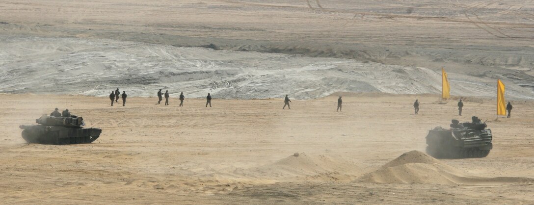 A M1-A1 Abrams Main Battle Tank, an Amphibious Assault Vehicle and Marines with India Company, Battalion Landing Team, 3rd Battalion, 2nd Marine Regiment, 22nd Marine Expeditionary Unit, attack targets during a Combined-Arms Live-Fire Exercise conducted as part of Exercise Bright Star 2009 in Egypt, Oct. 14, 2009. The multinational exercise is designed to improve readiness, interoperability, and strengthen the military and professional relationships among U.S., Egyptian and participating forces. Bright Star is conducted by U.S. Central Command and held every two years. Elements of the 22nd MEU are currently are participating in the multi-national exercise while serving as the theater reserve force for U.S. Central Command.::r::::n::(Official Marine Corps Photo by Cpl. Theodore W. Ritchie)::r::::n::