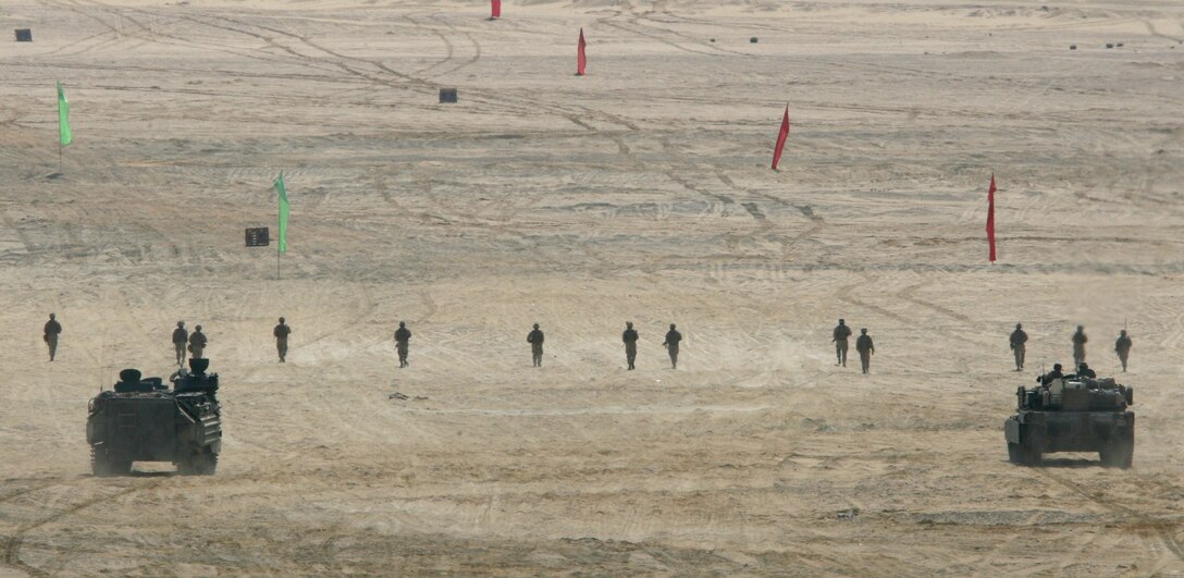 An M1-A1 Abrams Main Battle Tank, an Amphibious Assault Vehicle and Marines with India Company, Battalion Landing Team, 3rd Battalion, 2nd Marine Regiment, 22nd Marine Expeditionary Unit, attack targets during a Combined-Arms Live-Fire Exercise conducted as part of Exercise Bright Star 2009 in Egypt, Oct. 14, 2009. The multinational exercise is designed to improve readiness, interoperability, and strengthen the military and professional relationships among U.S., Egyptian and participating forces. Bright Star is conducted by U.S. Central Command and held every two years. Elements of the 22nd MEU are currently are participating in the multi-national exercise while serving as the theater reserve force for U.S. Central Command.::r::::n::(Official Marine Corps Photo by Cpl. Theodore W. Ritchie)::r::::n::