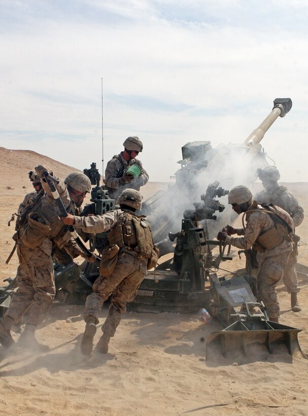 Marines from Sierra Battery, Battalion Landing Team, 3rd Battalion, 2nd Marine Regiment, 22nd Marine Expeditionary Unit, re-load after firing a 155mm shell from an M777 Howitzer during the Combined-Arms Live-Fire Exercise conducted as part of Exercise Bright Star 2009 in Egypt, Oct. 14, 2009. The multinational exercise is designed to improve readiness, interoperability, and strengthen the military and professional relationships among U.S., Egyptian and participating forces. Bright Star is conducted by U.S. Central Command and held every two years. Elements of the 22nd MEU are currently are participating in the multi-national exercise while serving as the theater reserve force for U.S. Central Command.::r::::n::