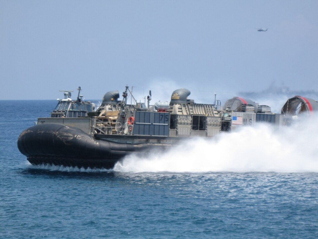A landing craft brings Marines and Sailors of the 11th Marine Expeditionary Unit ashore to begin training with the Timor Leste military Oct. 14 in an exercise that will focus on medical and dental assistance and military interaction.