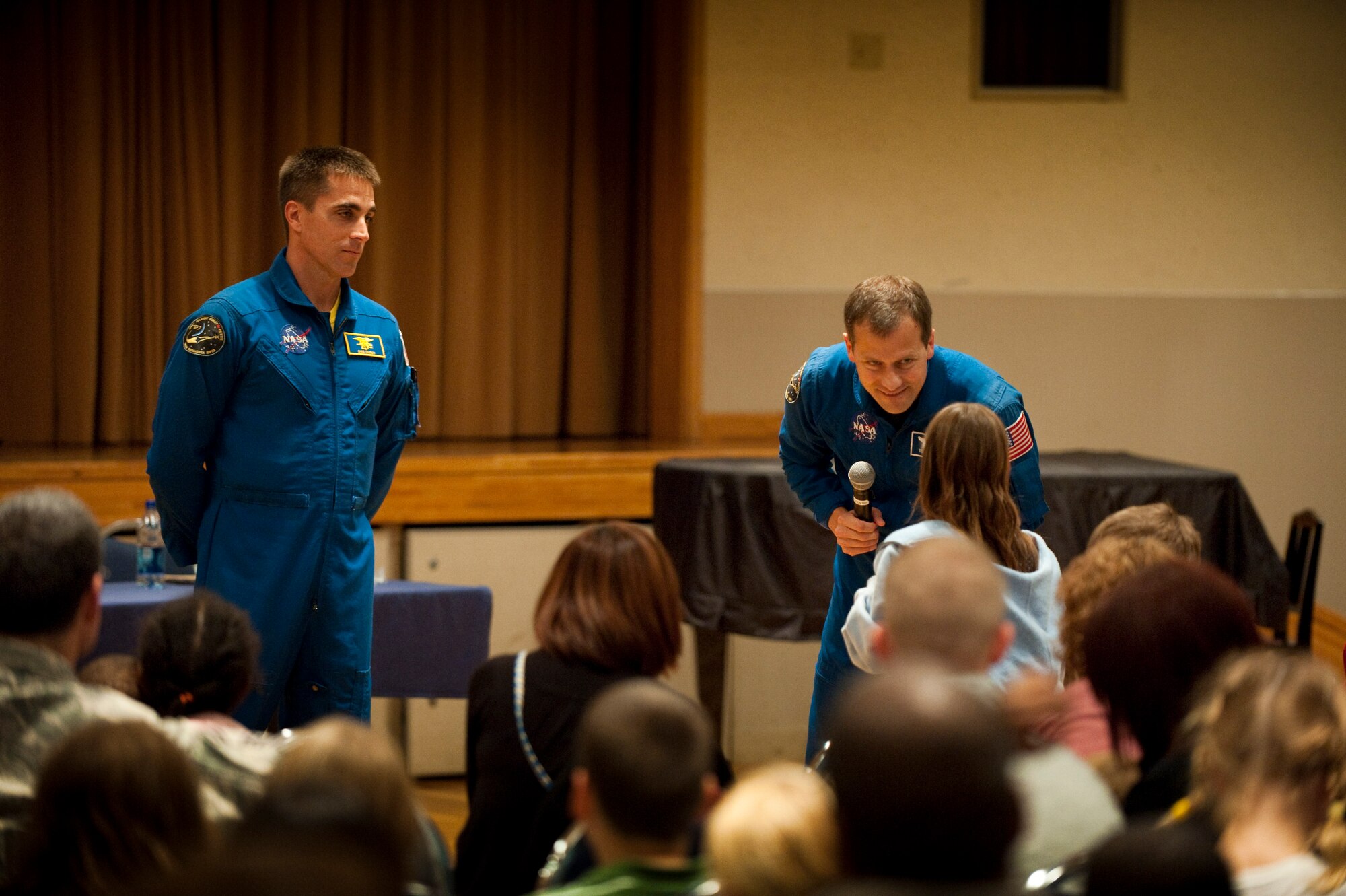 MISAWA AIR BASE, Japan -- NASA astronauts Chris Cassidy and Tom Marshburn answer questions at the Mokuteki Community Center Oct. 15. The astronauts presented a video and talked about their July mission to the International Space Station as part of an Armed Forces Entertainment tour. (U.S. Air Force photo/ Staff Sgt. Samuel Morse)