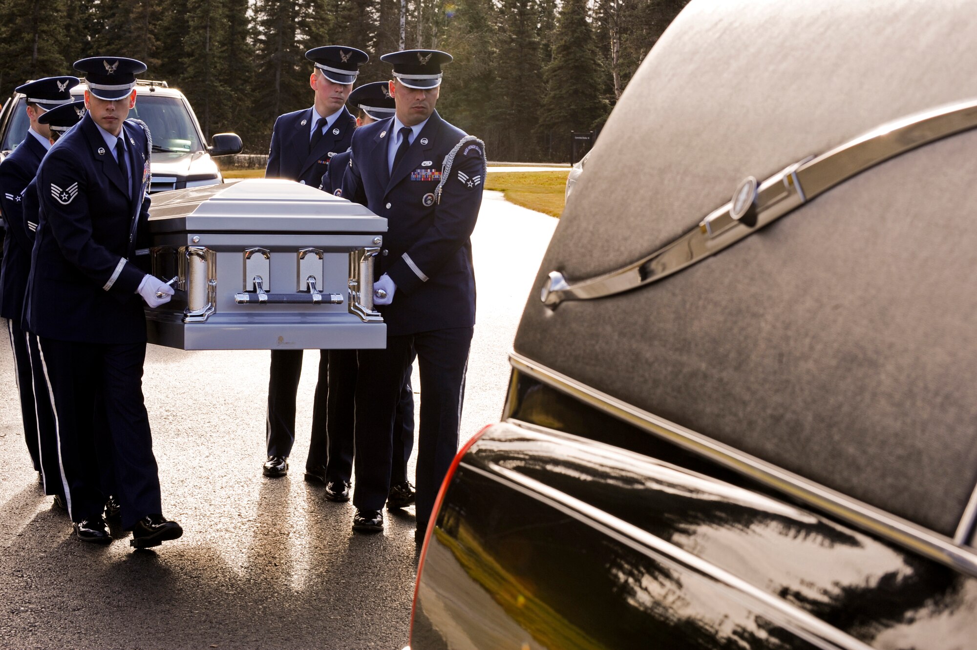 FORT RICHARDSON, Alaska -- Members of the Elmendorf Air Force Base Honor Guard prepare to transfer the coffin of Staff Sgt. Shawn Rankin during the funeral service at the Fort Richardson National Cemetery Oct. 15. Rankin of Anchorage, Alaska, was assigned to the 56th Aircraft Maintenance Squadron and served as an F-16 Fighting Falcon crew chief at Luke Air Force Base, Ariz. (U.S. Air Force photo/Staff Sgt. Joshua Garcia)