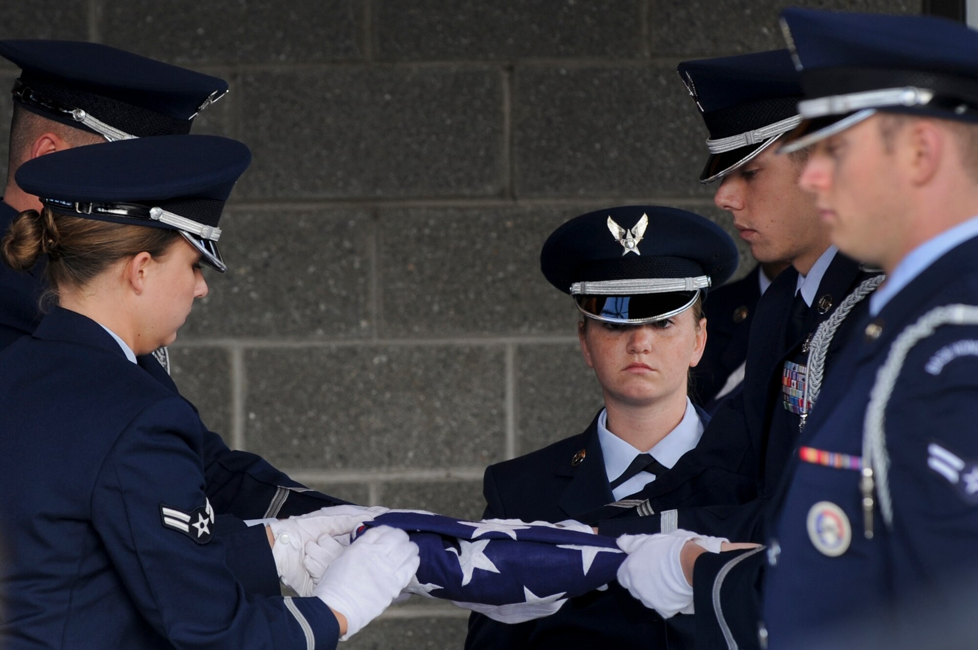 FORT RICHARDSON, Alaska -- Members of the Elmendorf Air Force Base Honor Guard finish folding the flag prior to presenting it to the parents of Staff Sgt. Shawn Rankin during his funeral service, at the Fort Richardson National Cemetery Oct. 15. Rankin of Anchorage, Alaska, was assigned to the 56th Aircraft Maintenance Squadron and served as an F-16 Fighting Falcon crew chief at Luke Air Force Base, Ariz. (U.S. Air Force photo/Staff Sgt. Joshua Garcia)