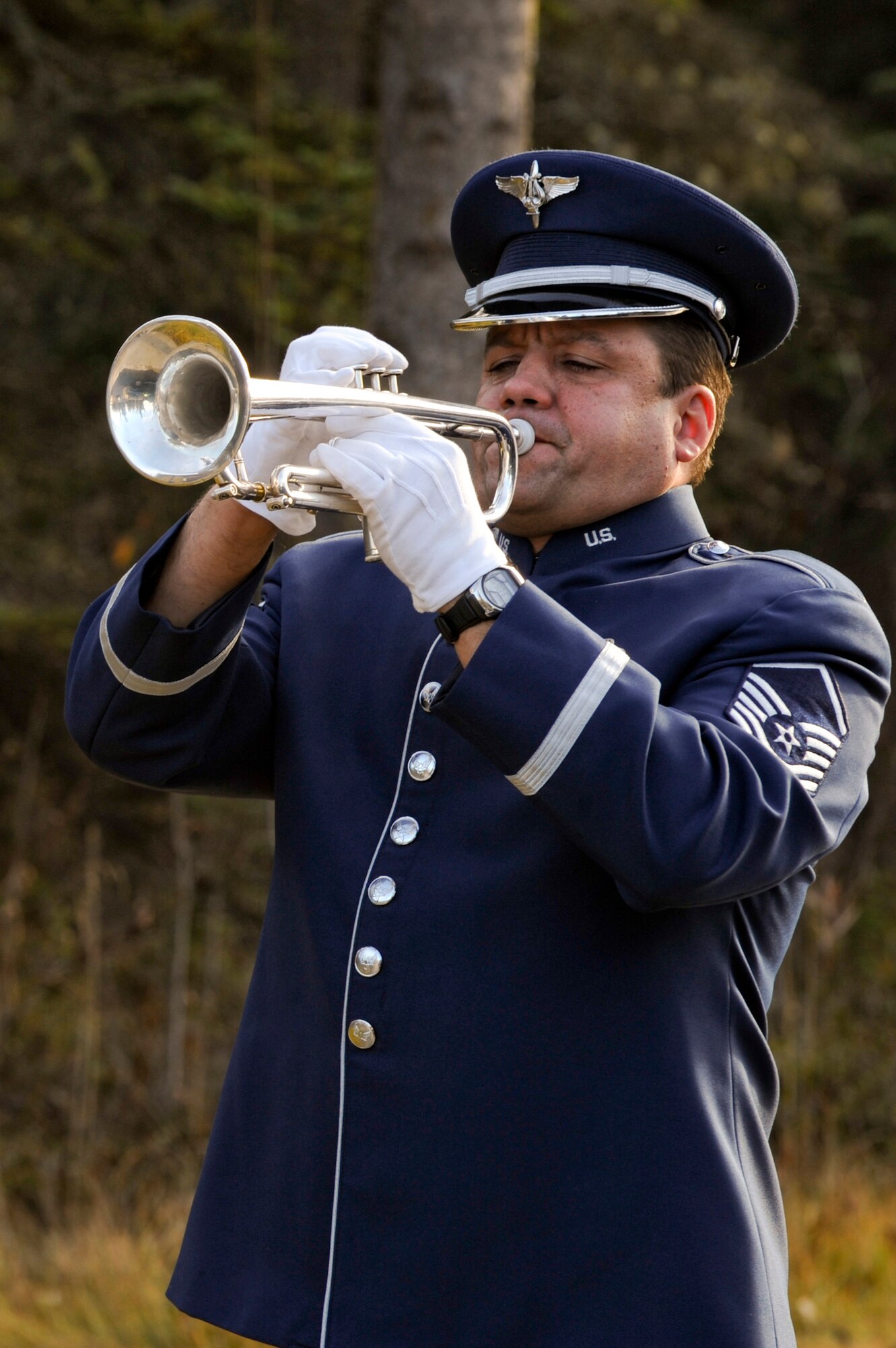 FORT RICHARDSON, Alaska -- Master Sgt. Sam Cliff, U.S. Air Force Band of the Pacific, plays taps during the funeral service for Staff Sgt. Shawn Rankin, here at the Fort Richardson National Cemetery Oct. 15. Rankin of Anchorage, Alaska, was assigned to the 56th Aircraft Maintenance Squadron and served as an F-16 Fighting Falcon crew chief at Luke Air Force Base, Ariz. (U.S. Air Force photo/Staff Sgt. Joshua Garcia)