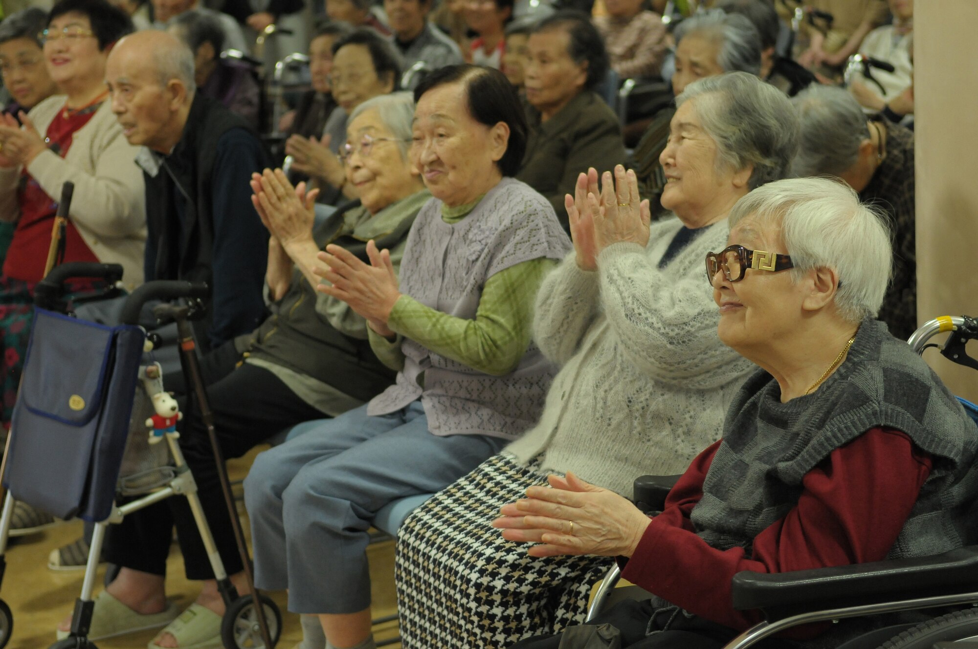 HIROSHIMA, Japan -- Residents of the Yano-Orizuru-en nursing home enjoy a performance by the U.S. Air Force Band of the Pacific-Asia Oct. 14. Constructed only three years ago, the one-of-a-kind home?s residents are all survivors of the Aug. 6, 1945, atomic bomb attack on Hiroshima. Residents range in age from 66 to 107 years and there?s a waiting list of nearly 2,000 to get into the facility. (U.S. Air Force photo/Airman 1st Class Sean Martin)