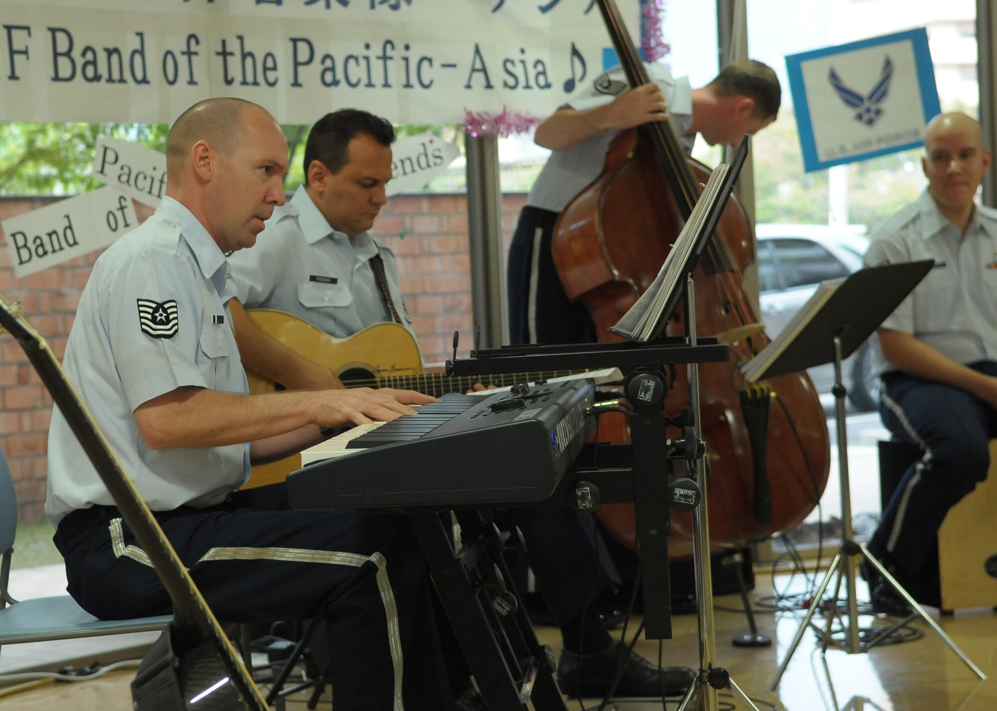HIROSHIMA, Japan -- Tech. Sgt. Vinnie Dublino, U.S. Air Force Band of the Pacific-Asia keyboardist, performs for residents of the Yano-Orizuru-en nursing home here Oct. 14. Constructed only three years ago, the one-of-a-kind home?s residents are all survivors of the Aug. 6, 1945, atomic bomb attack on Hiroshima. Residents range in age from 66 to 107 years and there?s a waiting list of nearly 2,000 to get into the facility. (U.S. Air Force photo/Airman 1st Class Sean Martin)