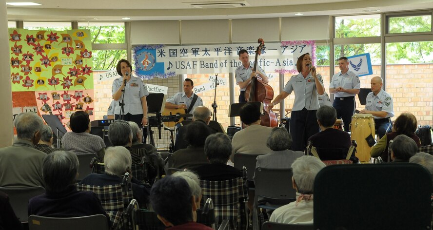 HIROSHIMA, Japan -- The U.S. Air Force Band of the Pacific-Asia performs for the residents of the Yano-Orizuru-en nursing home here Oct. 14. Constructed only three years ago, the one-of-a-kind home?s residents are all survivors of the Aug. 6, 1945, atomic bomb attack on Hiroshima. Residents range in age from 66 to 107 years and there?s a waiting list of nearly 2,000 to get into the facility. (U.S. Air Force photo/Airman 1st Class Sean Martin)