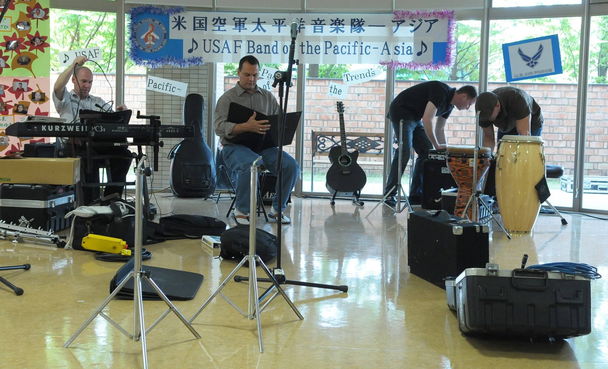 HIROSHIMA, Japan -- Members of the U.S. Band of the Pacific-Asia set up for the band's first-ever performance at the Yano-Orizuru-en nursing home here Oct. 14. Constructed only three years ago, the one-of-a-kind home?s residents are all survivors of the Aug. 6, 1945, atomic bomb attack on Hiroshima. Residents range in age from 66 to 107 years and there?s a waiting list of nearly 2,000 to get into the facility. (U.S. Air Force photo/Airman 1st Class Sean Martin)