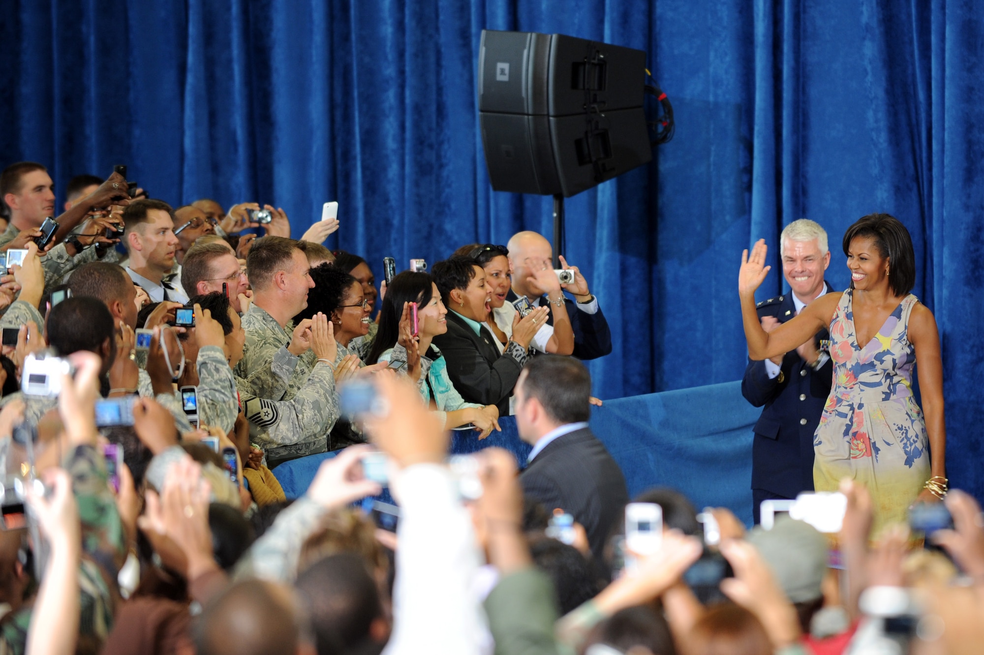 First Lady Michelle Obama and Maj. Gen. Charles R. Davis wave to the crowd before the first lady gave a speech on family values during a visit to Eglin Air Force Base, Fla. on Oct. 15. General Davis is the commander of the Air Armament Center at Eglin. (U.S. Air Force photo/Staff Sgt. Desiree N. Palacios)