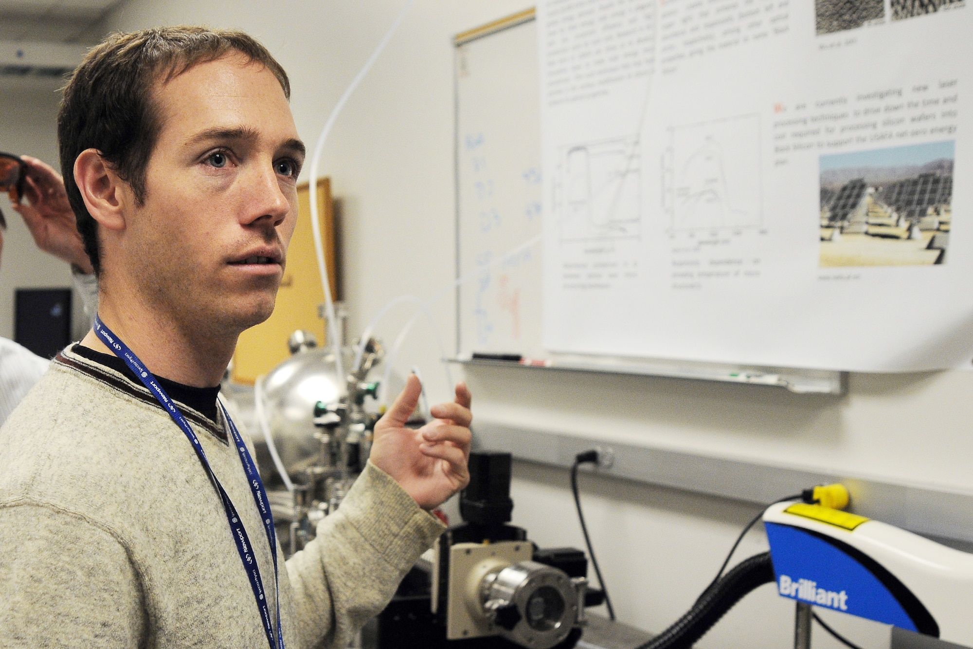 Dr. Michael Shaffer describes a research project Oct. 9, 2009, to determine why black silicon, a product from sulfur being added to silicon using lasers, absorbs up to 500 times more light than regular silicon. The research, underway at the U.S. Air Force Academy in Colorado Springs, Colo., may decrease the cost per kilowatt-hour to produce solar energy. Doctor Shaffer is a contractor with MITRE Corporation. (U.S. Air Force photo/Rachel Boettcher)