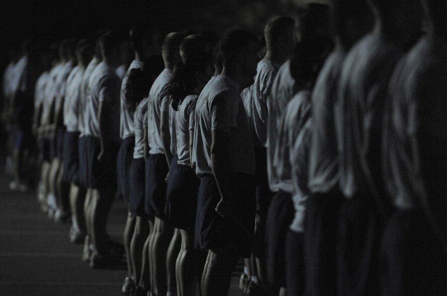 MOODY AIR FORCE BASE, Ga. -- Members of the 820th Security Forces Group, 93rd Air Ground Operations Wing, a tenant wing on Moody, and current Airmen Leadership School students fall into a formation before the start of reveille here Oct. 14. The group later participated in the Airman 1st Class Leebernard Chavis memorial workout in remembrance of the three-year anniversary of his death during a combat mission. (U.S. Air Force photo by Staff Sgt. Elizabeth Rissmiller)