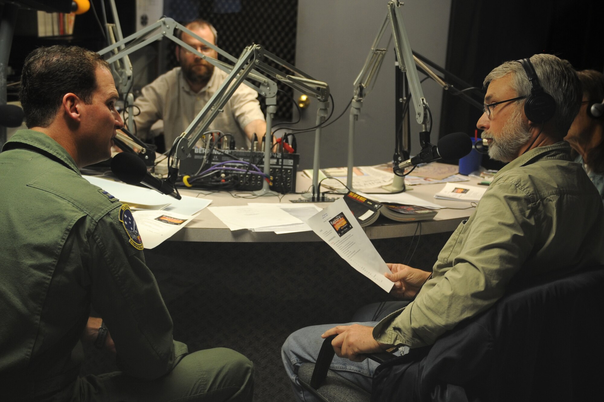 ALAMOGORDO, N.M. -- Capt. August Pfluger, 49th Fighter Wing Open House director, speaks with Michael Shinabery, New Mexico Museum of Space History, during a KRSY radio show here Oct. 8. Captain Pfluger and Mr. Shinabery spoke about the upcoming Open House at Holloman Air Force Base, N.M., where all New Mexico bases will be represented. The Open House will feature events for people of all ages, including aerial acts, static displays, a kid's zone and photo opportunities. (U.S. Air Force photo by Senior Airman Rachel Kocin)